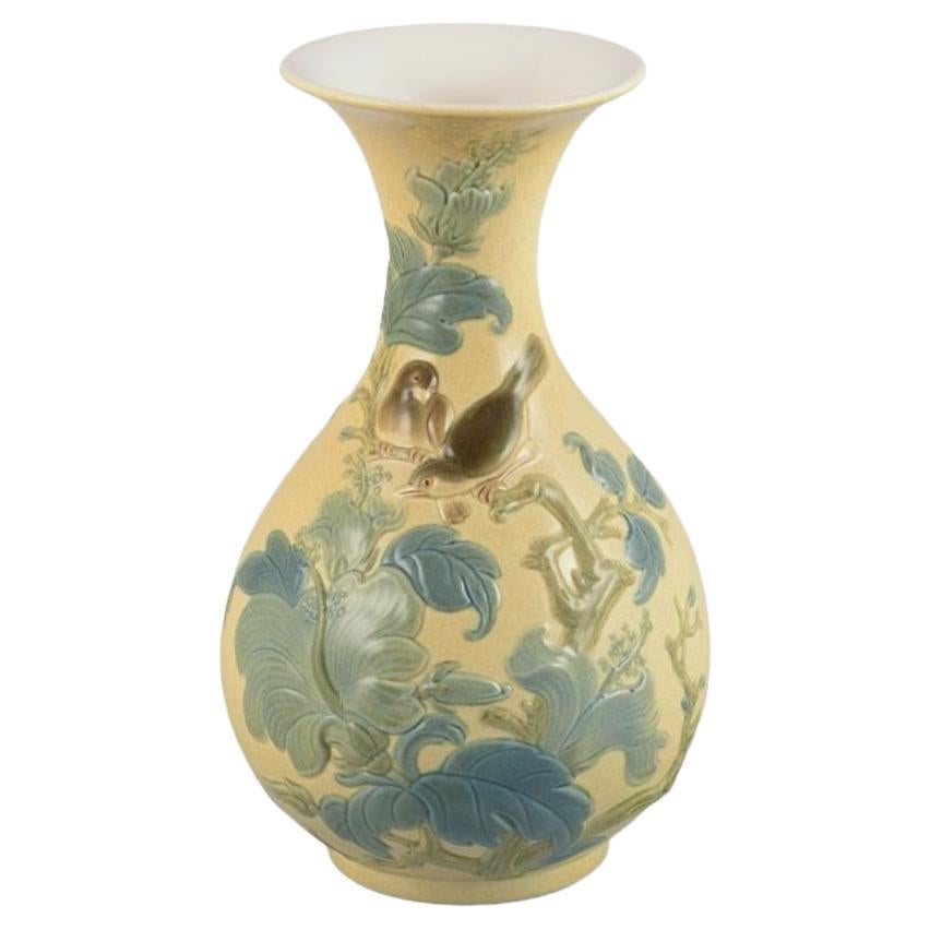 Lladro, Spain, large porcelain vase with flowers and birds in relief. 