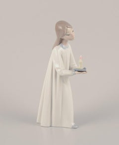 Lladro, Spain. Two porcelain figurines. Girl with a lamp and an angel with child