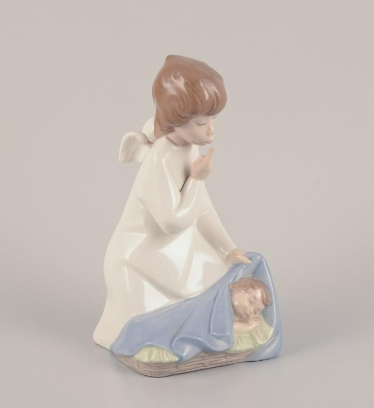 Porcelain Lladro, Spain. Two porcelain figurines. Girl with a lamp and an angel with child For Sale