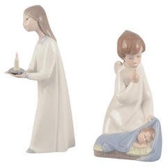Vintage Lladro, Spain. Two porcelain figurines. Girl with a lamp and an angel with child