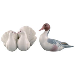 Deux figurines en porcelaine de Lladro, Espagne, deux pigeons et un canard mandarin