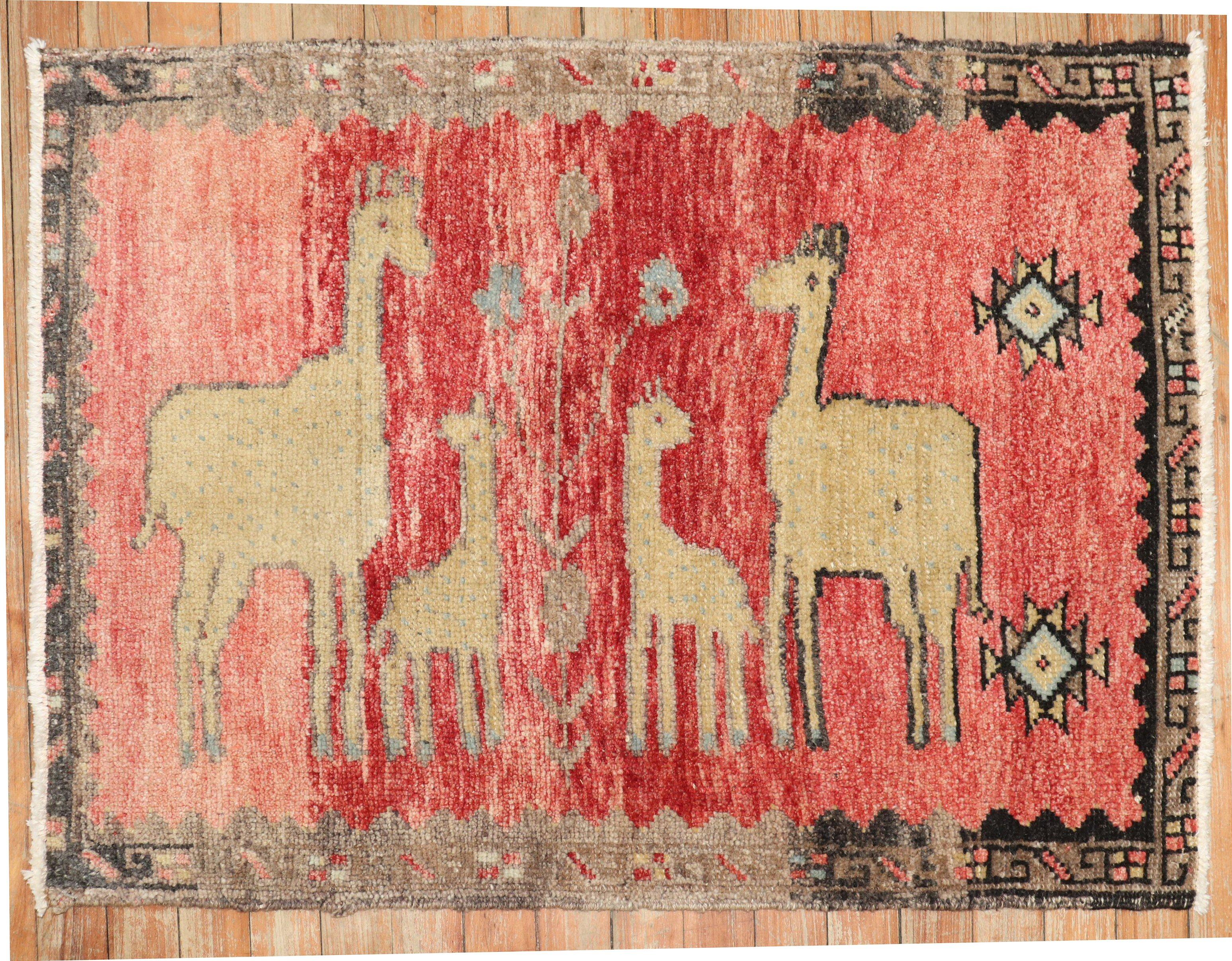A cute one of a kind Mid-20th Century Hand-knotted Turkish Anatolian Pictorial rug depicting a llama goats on a red field

Measures: 2'2'' x 3'.