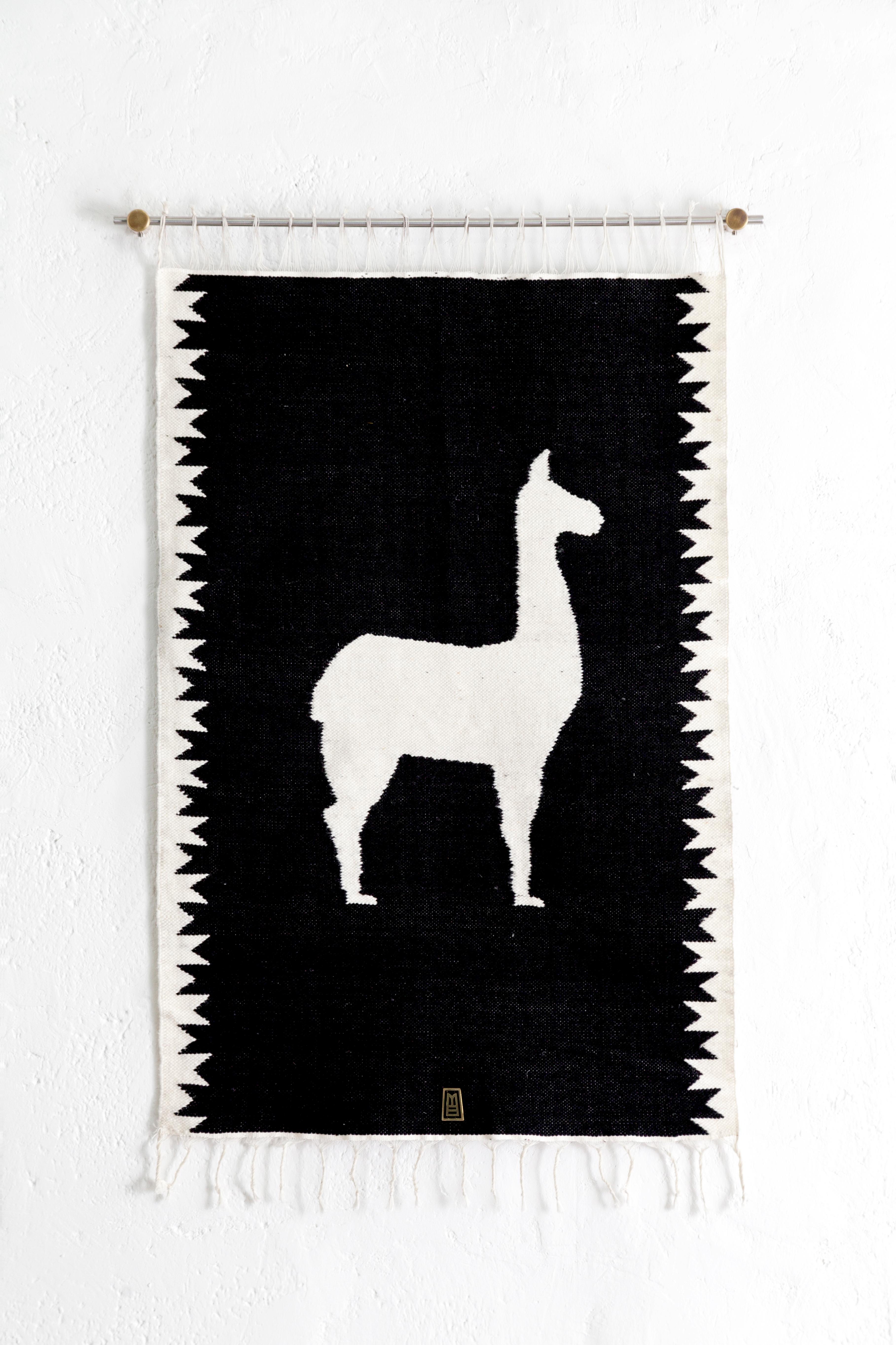Handwoven sheep wool tapestry with wall-mounting lathed bronze bases, and stainless steel rod.

Capturing the essence of the Andes, these pieces are created using ancient weaving techniques yet loomed through an innovative approach of traditional