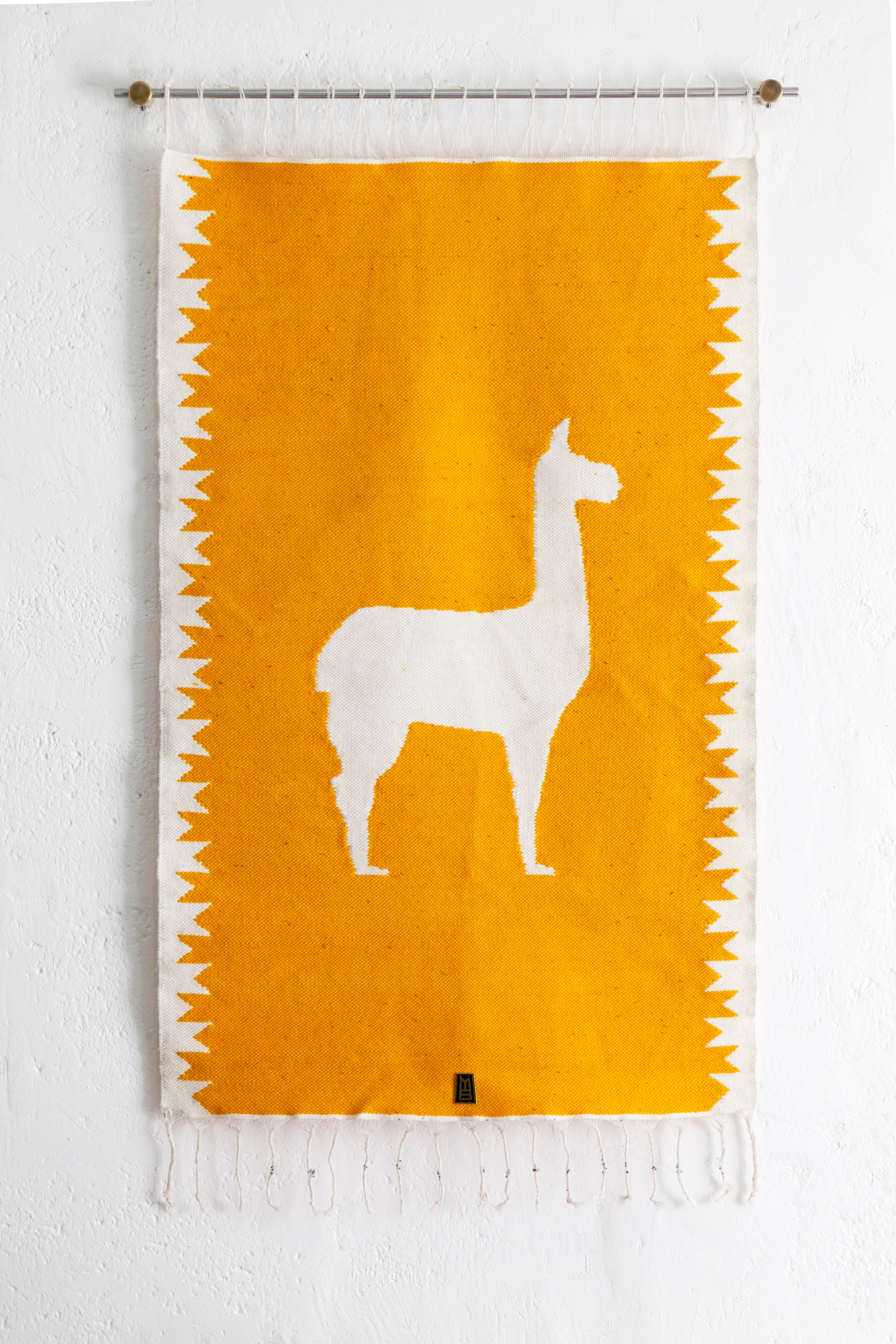 Handwoven sheep wool tapestry with wall-mounting lathed bronze bases, and stainless steel rod.

Capturing the essence of the Andes, these pieces are created using ancient weaving techniques yet loomed through an innovative approach to traditional