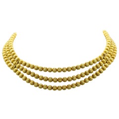 lles Lalaounis, Triple Strand Gold Bead Necklace