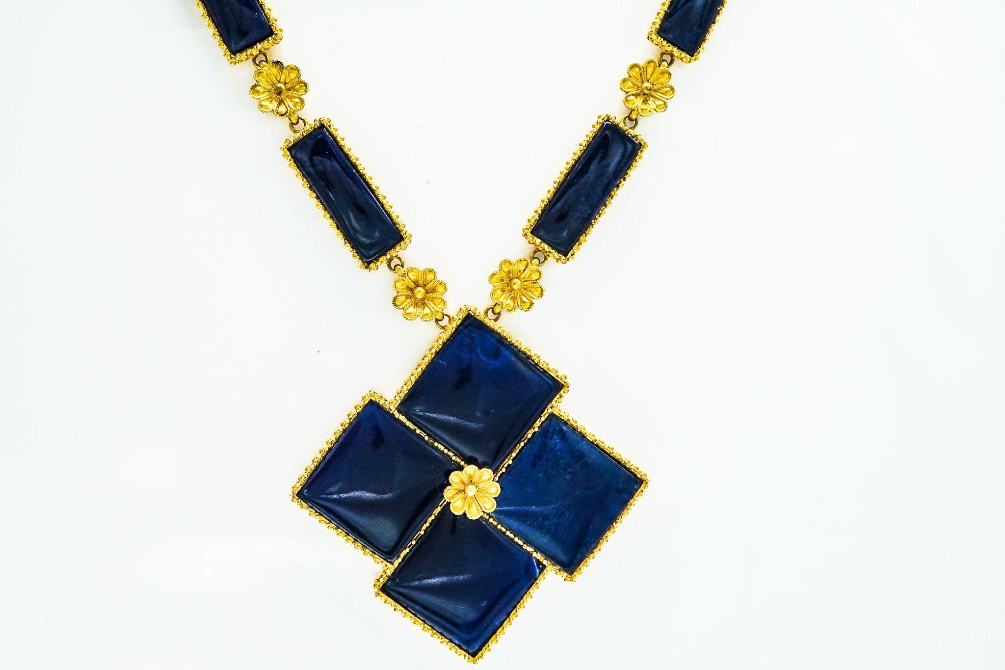 This beautiful piece features rectangular sodalite links within granulated frames spaced by concave florets, the suspending pendant takes the form of a four square-shaped off-set sodalitie centering one floret, signed Llias Lalaounis, with makers's