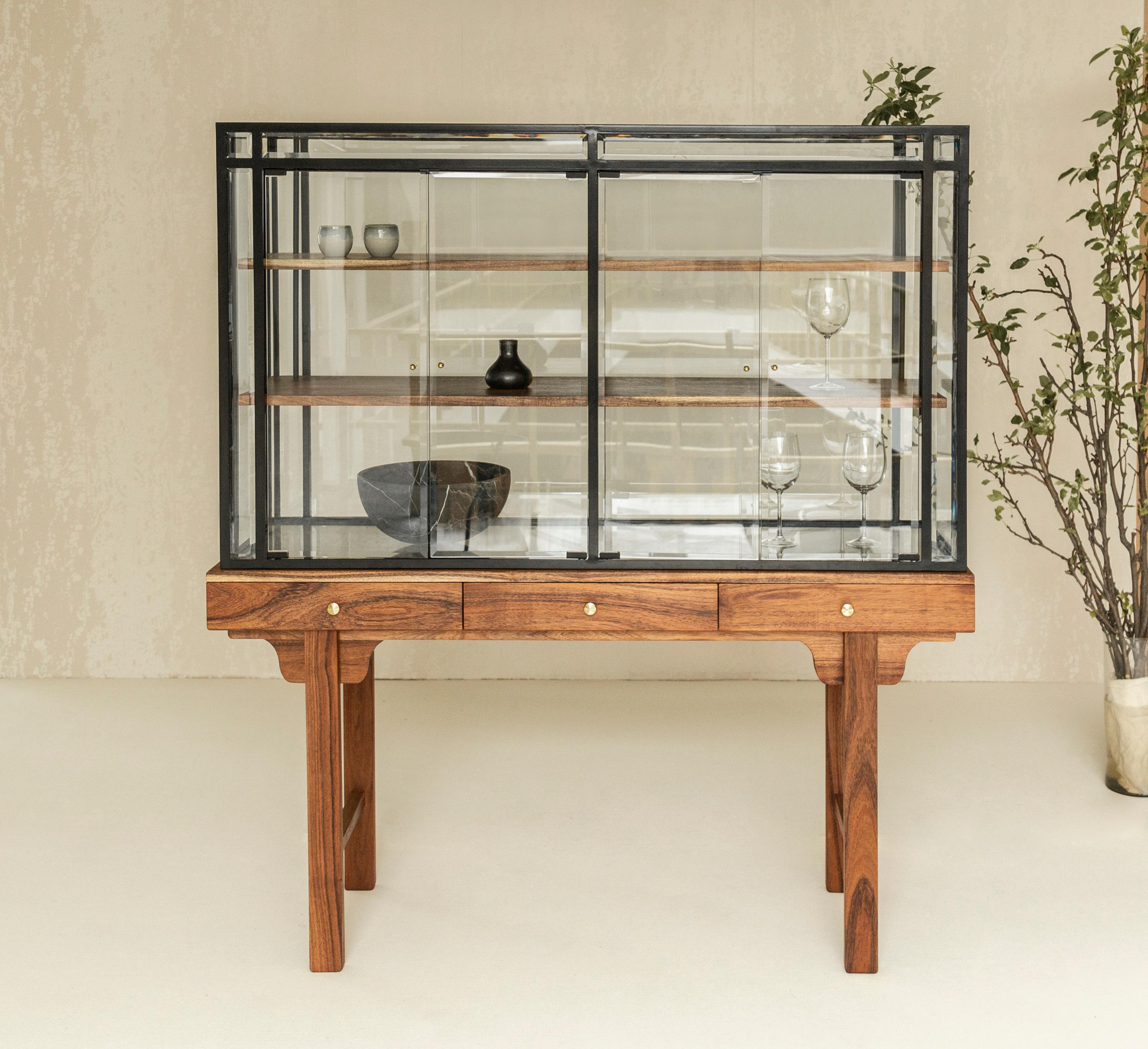 The Lloyd cabinet is inspired by antique chinese cabinets and glass work. It is made with a Mexican wood called Tzalam and the iron cabinet is crafted by the most skilled artisans. It is a combination of materials that likes to call attention and is