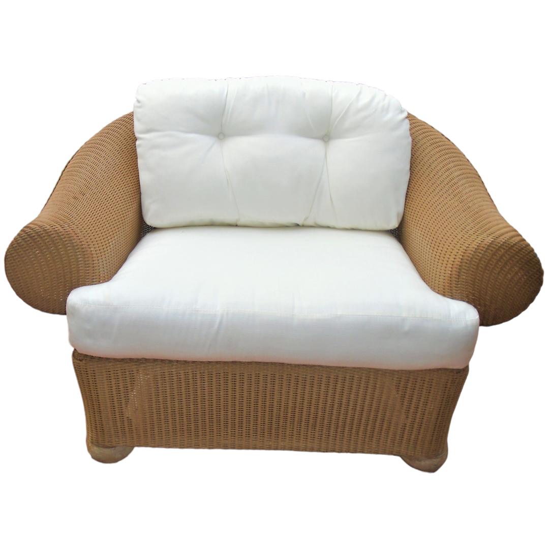 This Lloyd Flanders oversize chair and ottoman set is the perfect addition to any home.  Made with high-quality vinyl wicker and a durable frame, this set is designed to last.  The classic white color and beautiful wicker texture create a stylish