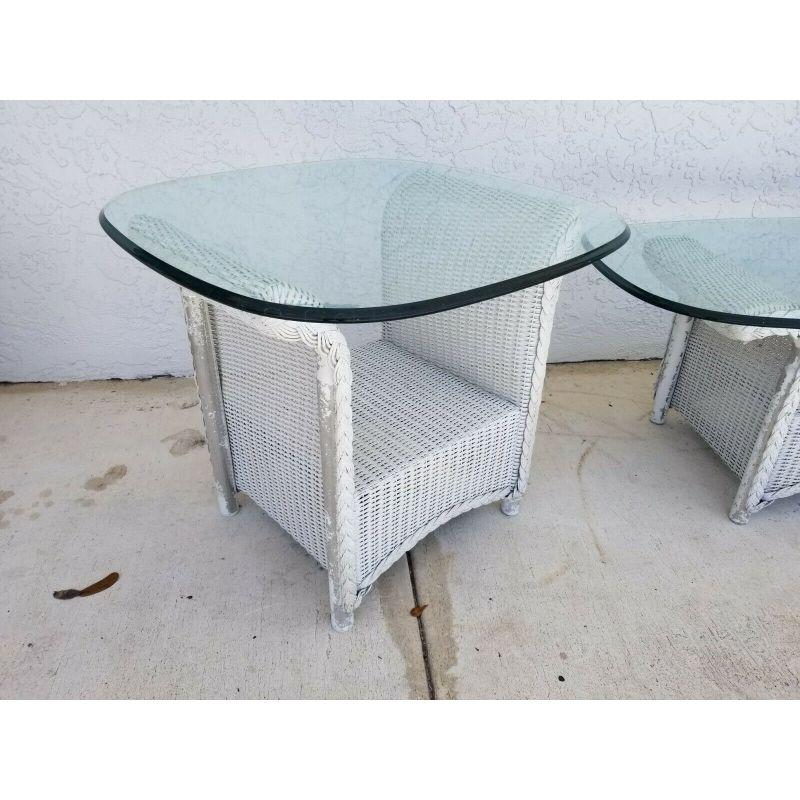 Offering one of our recent palm beach estate fine furniture acquisitions of A 
Vintage Set of 3 Lloyd Loom Flanders Wicker Weather Resistant Tables w Glass
With the original Ogee edge glass tops.

Approximate Measurements in Inches
(2) Side