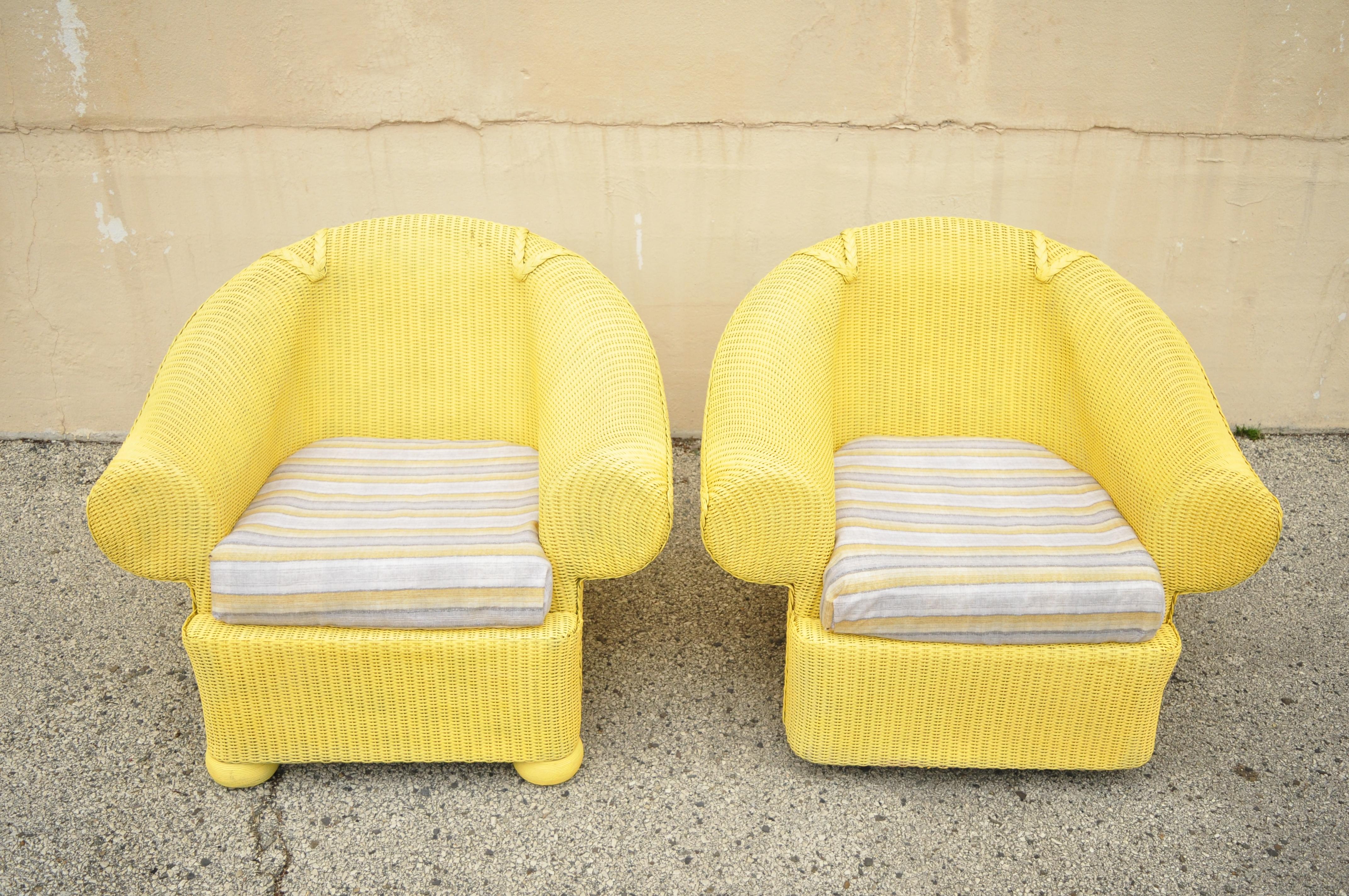 Lloyd Flanders loom yellow wicker large oversize sunroom lounge club chairs, a pair. Item features (1) revolving club chair with pedestal base, (1) lounge club chair with bun feet, large wide frames, woven wicker trim, rolled arms, yellow painted