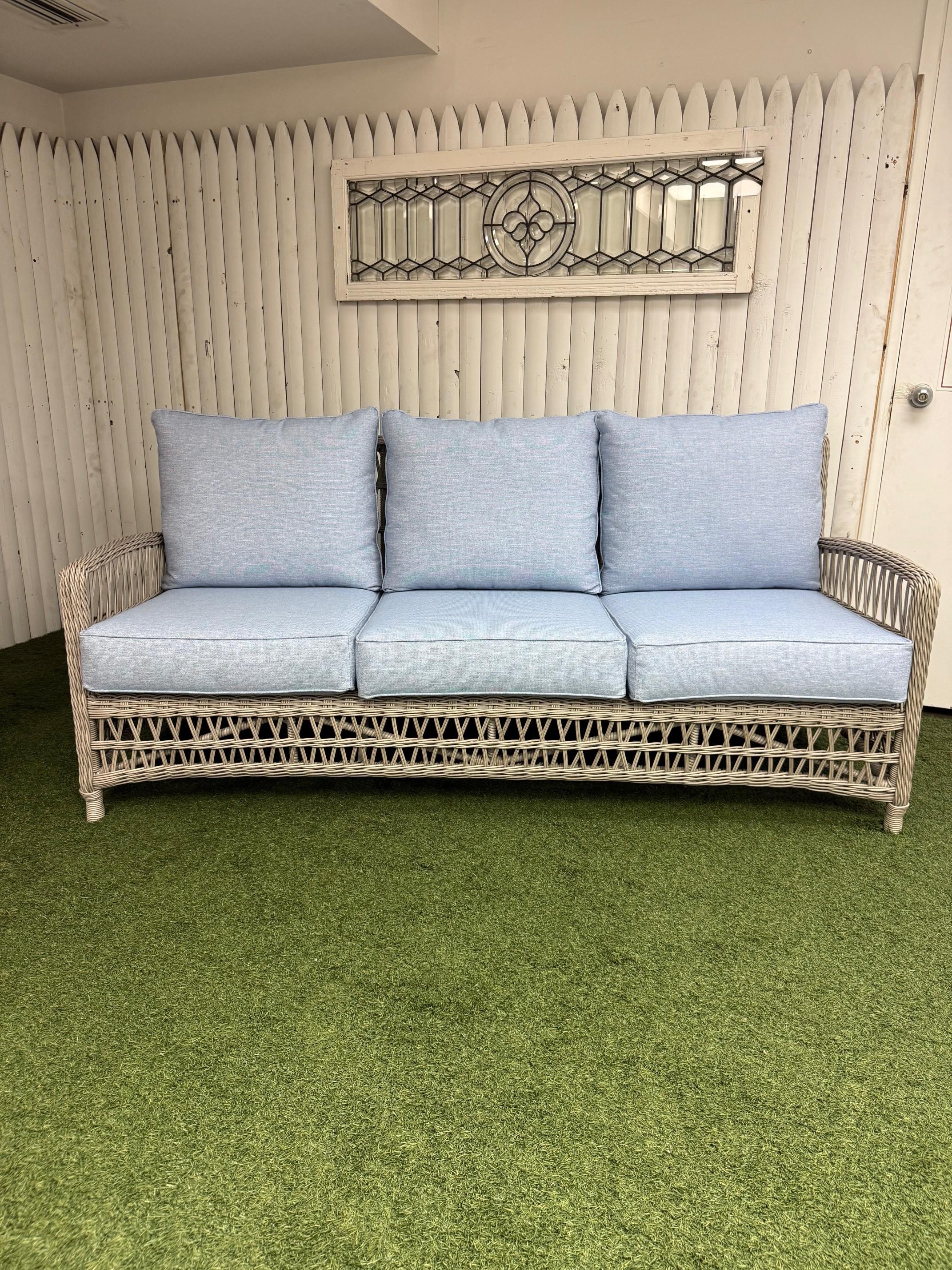 Lloyd Flanders Mackinac Sofa with Sunbrella cushions brand new in excellent condition. Lloyd Flanders vinyl furniture is made with 100% virgin vinyl and has no added ''filler.'' This assures that Lloyd Flanders' vinyl will remain soft and pliable