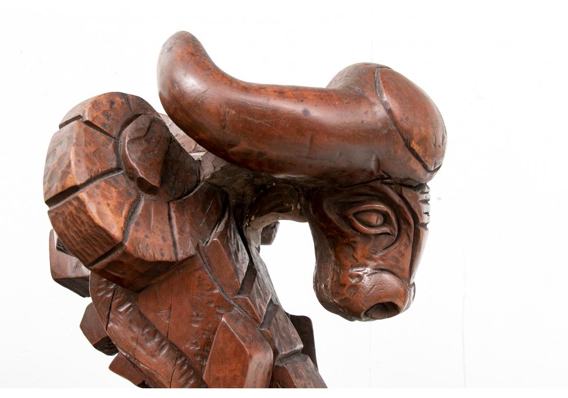 A composite abstract angular horned animal headed piece with carved details. Mounted on a tiered black marble base. The artist was a member of The Art Students League in NYC and his works have been exhibited in numerous art shows. 
Dimensions: H.