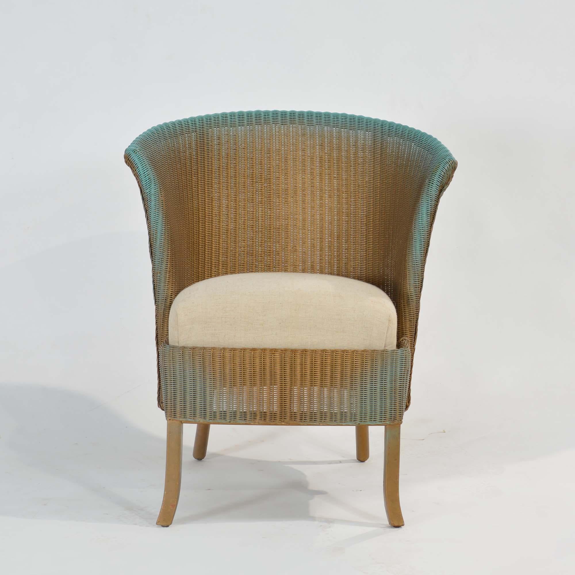 Lloyd Loom Lusty chair
The Lloyd loom or weave is made from craft paper woven onto wire.  With sprung seat newly upholstered in undyed cotton, original gold/turquoise paint in very good order.
English, mid 20th century