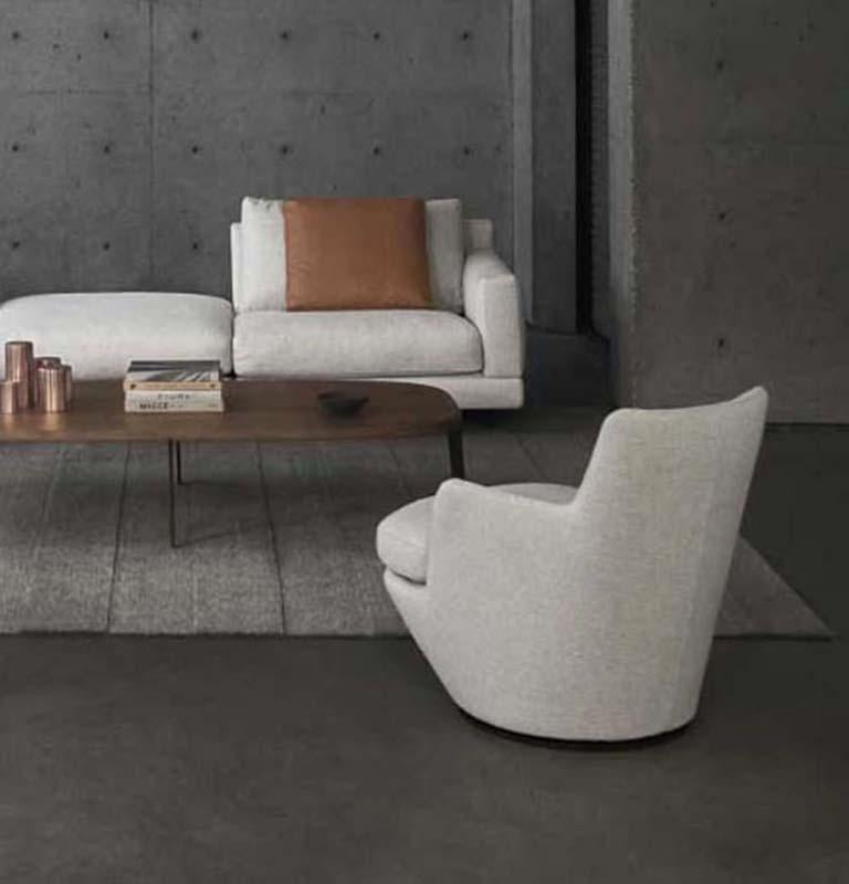 Lo Turn is a swivel armchair with open arms. The low back, down seating, and small footprint make this is a remarkable little chair.

Additional Information:
- Dimensions: D. 87 x W. 70 x H. 75 cm. 

Lo Turn beige fabric swivel armchair, by