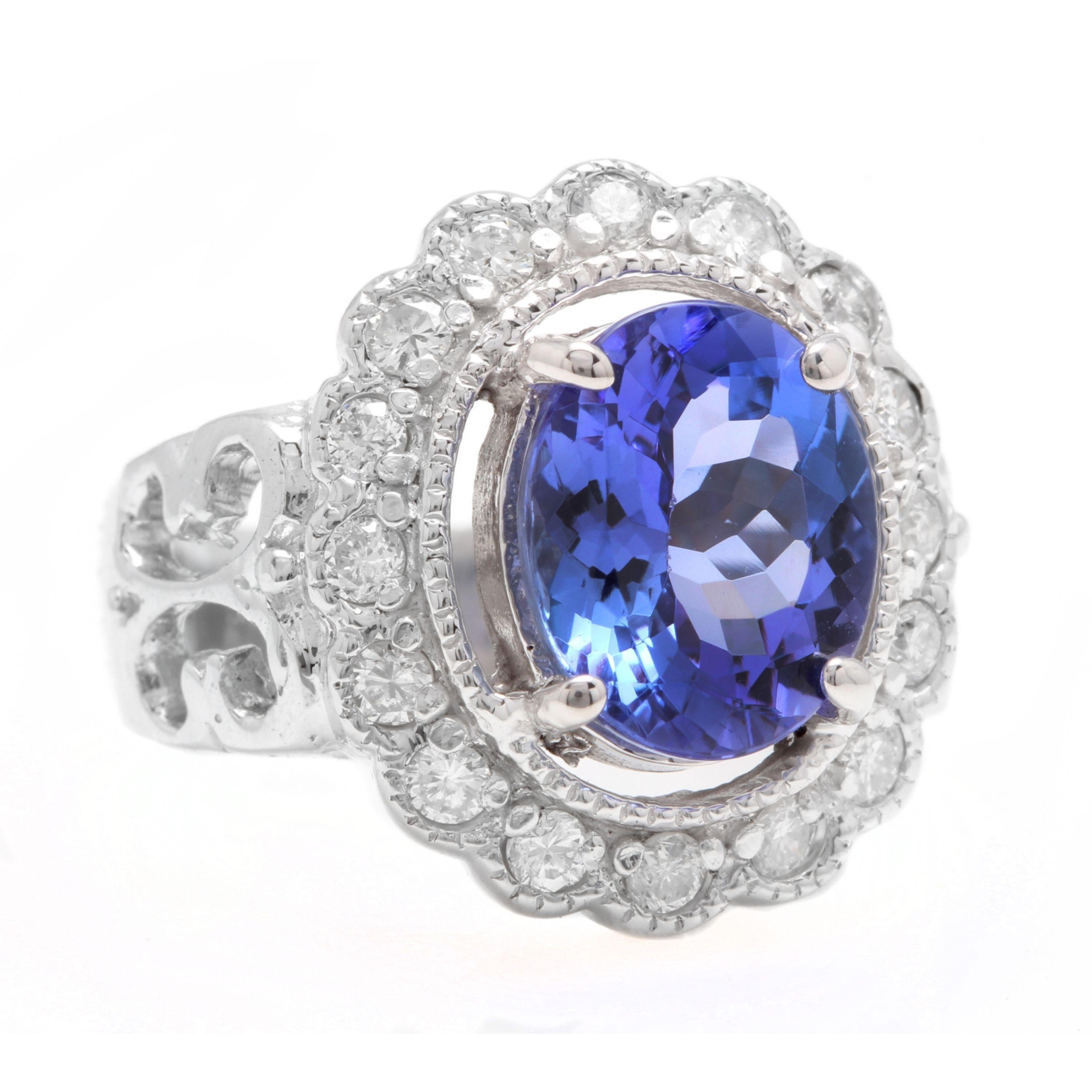 5.75 Carats Natural Very Nice Looking Tanzanite and Diamond 14K Solid White Gold Ring

Total Natural Oval Cut Tanzanite Weight is: Approx. 5.20 Carats

Tanzanite Measures: Approx. 11.00 x 9.00mm

Natural Round Diamonds Weight: Approx. 0.55 Carats