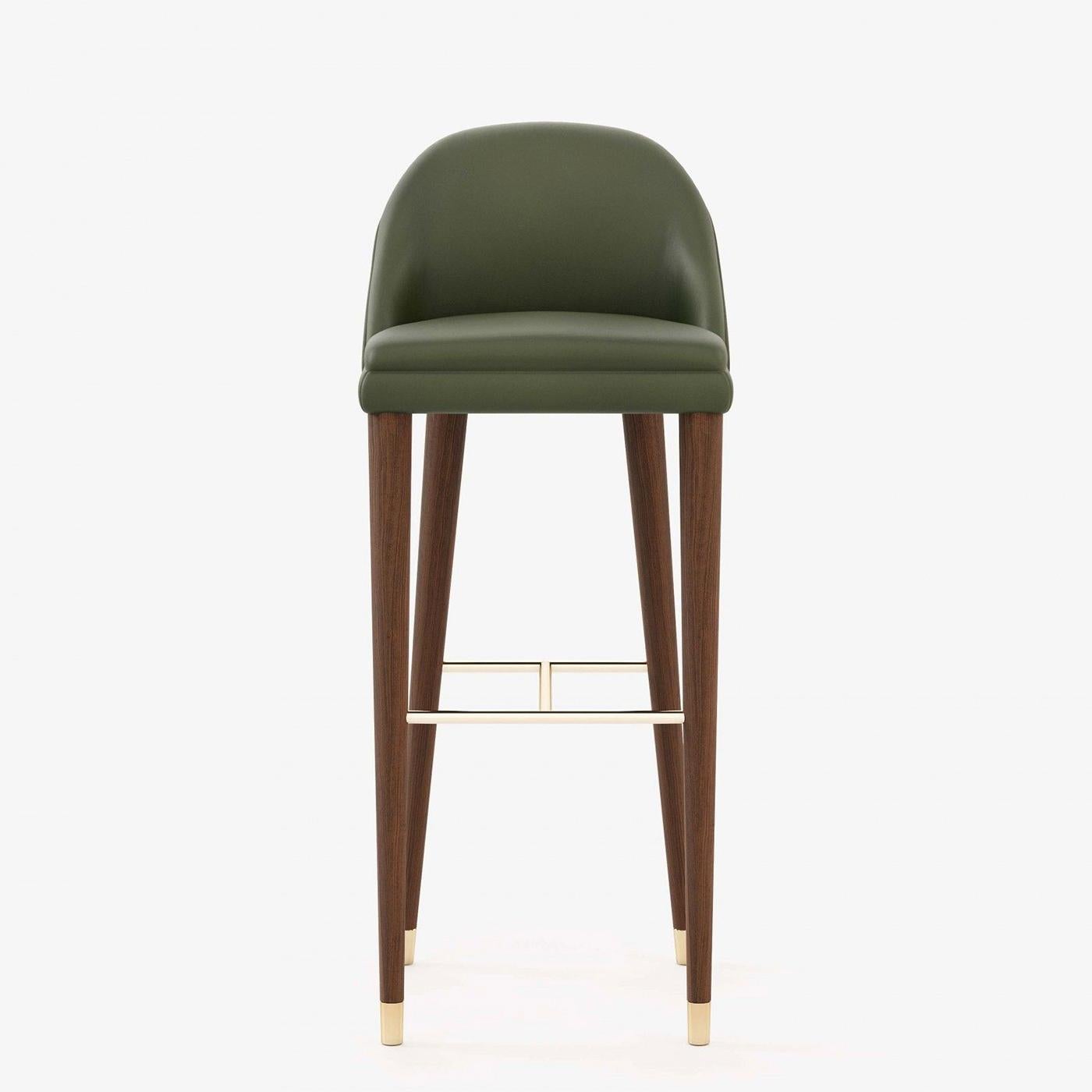 Loanne High Bar Stool with wooden feet in walnut matte finish and 
with polished stainless steel footrests in gold finish, feet at the bottom
of the legs in polished stainless steel in gold finish. Upholstered
and covered with green genuine