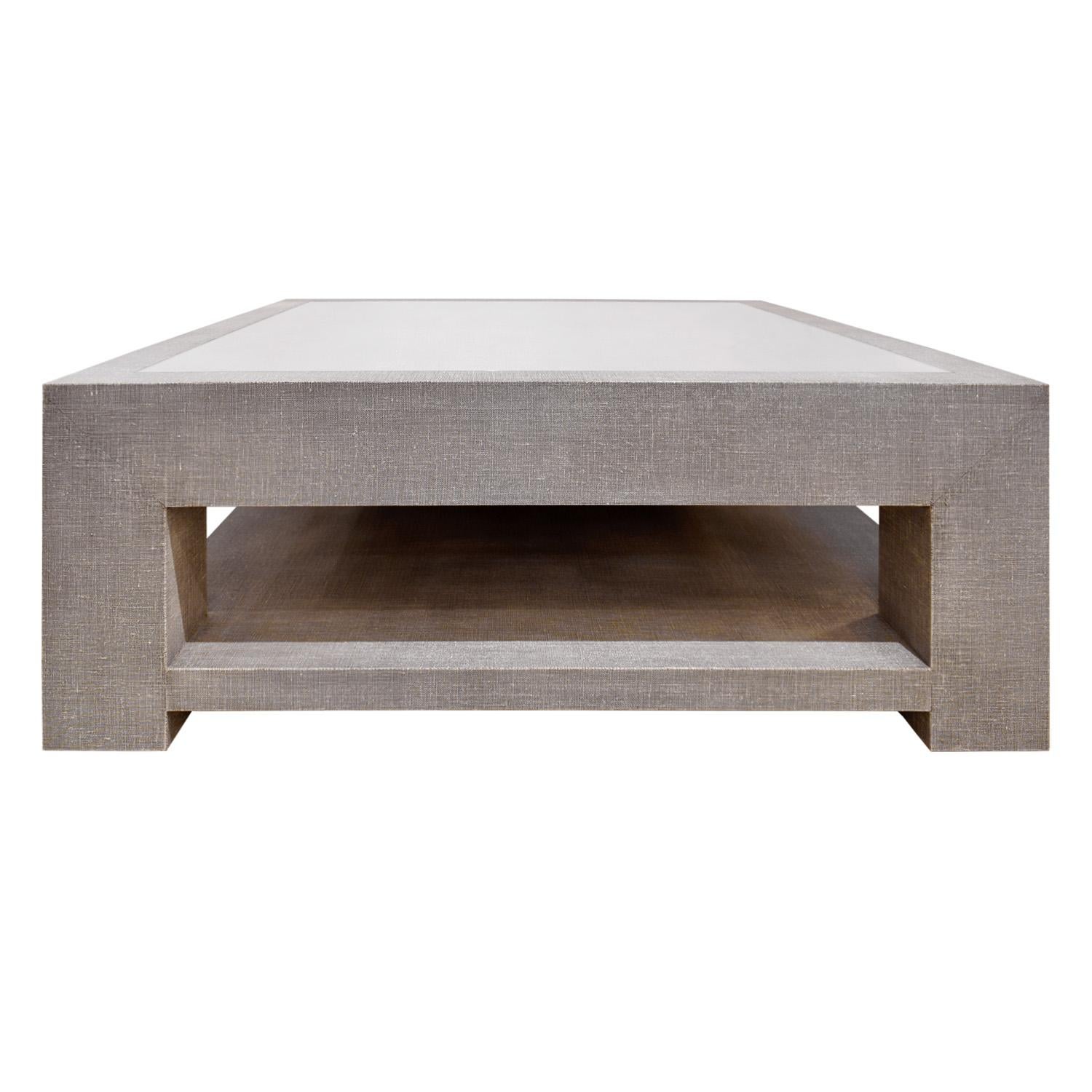Coffee table model 1020 covered in 2-tone lacquered linen (as shown) with lower shelf and inset Starfire glass top by Evan Lobel for Lobel Originals. This table is made to order. It can be made in any color and in any size and covered in lacquered