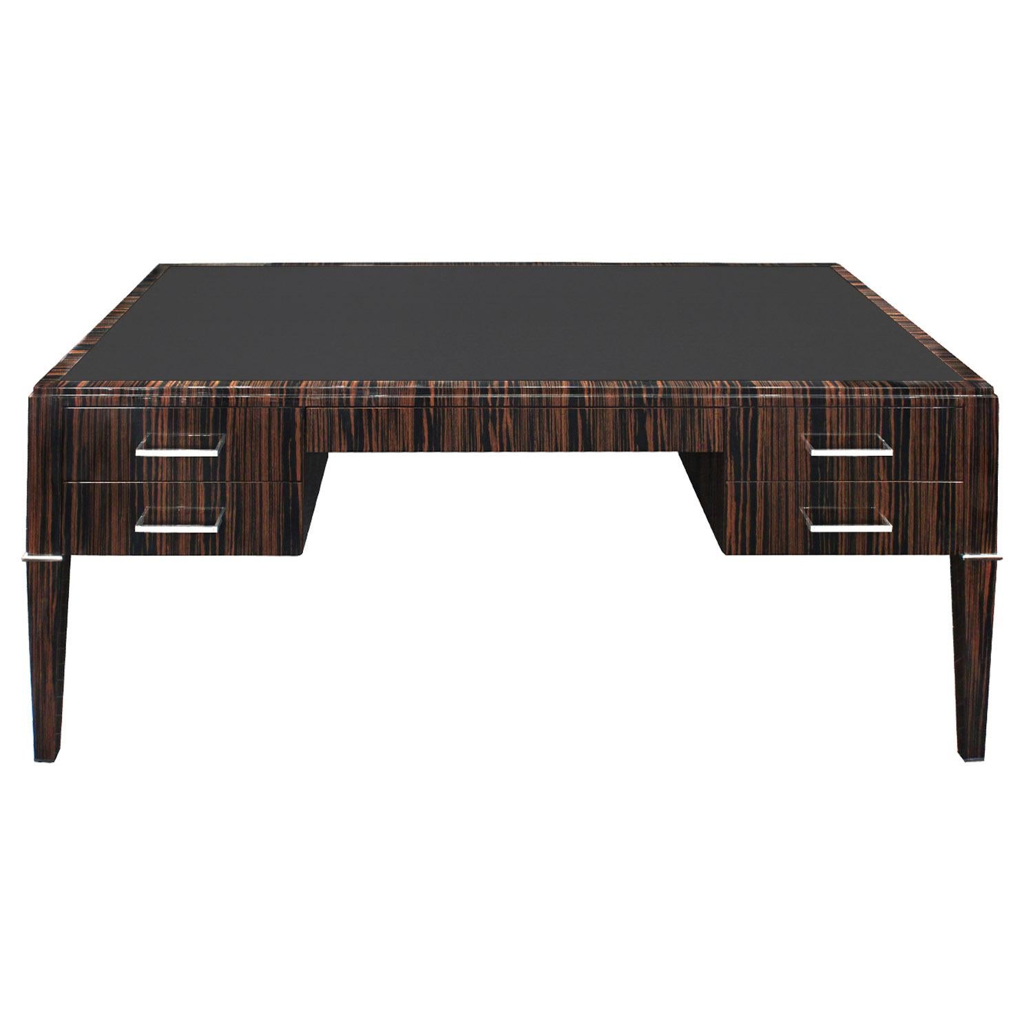 Desk in mirror polished Macassar ebony with handcrafted stainless steel pulls and accents and inset leather top by Evan Lobel for Lobel Originals. This can be made to any size and configuration. We customize each one to spec. Lead time 12-14 weeks.