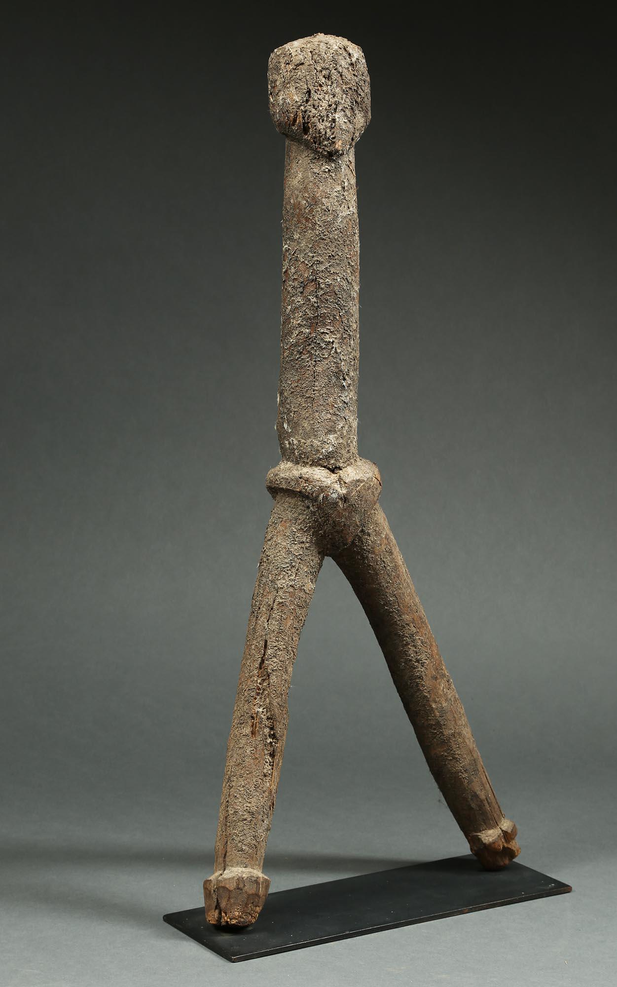 Abstract tribal wood ancestral figure from the Dagari, a subgroup of the Lobi People of Ghana and Burkina Faso, West Africa. Created in the early to mid-20th century. It is a stylized figure with legs out and simple form to body and face. Carved