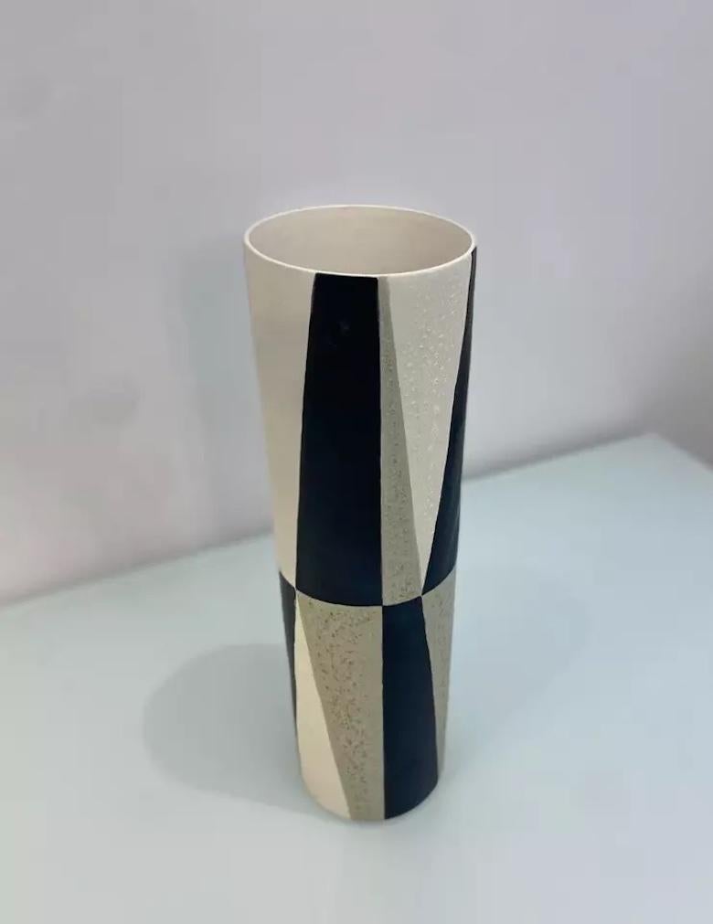 A contemporary L'Objet hand crafted vase, made from porcelain it has a textured finish. 

With an abstract black, grey and neutral design, it is an eye catching piece.

L'Objet make high quality designer unique hand crafted pieces that are made to
