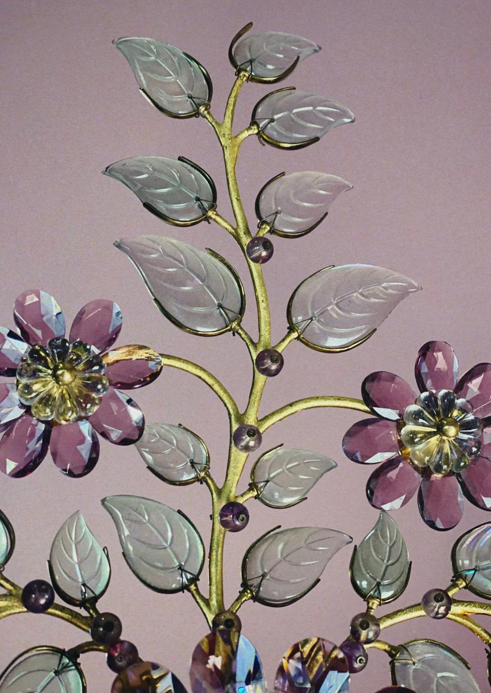 Designed by Oswald Haerdtl for Lobmeyr in 1955. Pink crystal flowers with beautiful green iridescent leaves. Solid brass. 