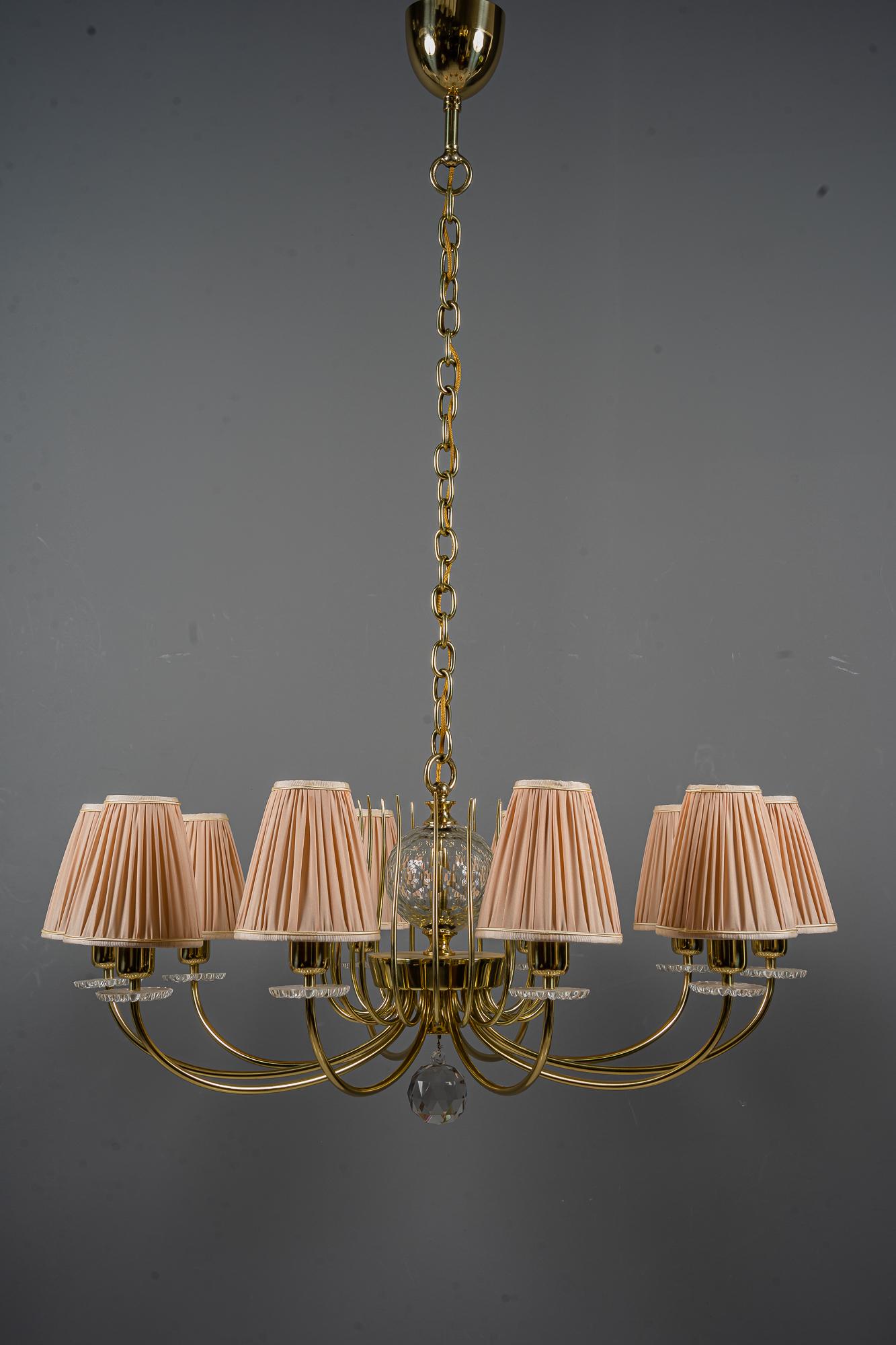 Lobmeyr chandelier Vienna, around 1950s.
Polished and stove enameled.
Original cut glasses.
The shades are replaced (new).
The height is easily to change by replacing the chain parts.