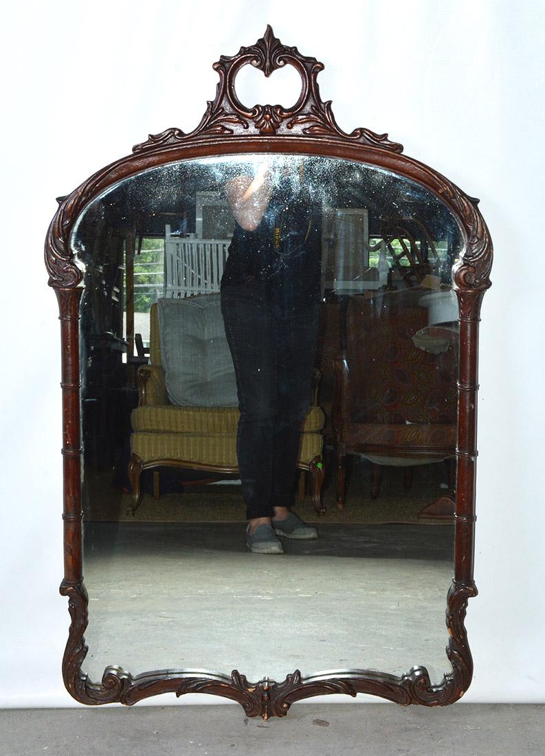 Old world elegance is the key to this antique Georgian mahogany hall mirror. Beautifully hand carved scroll work on the frame gives the mirror extra panache. Think beyond the hall: over a sideboard in the dining room, above a dressing table, above a