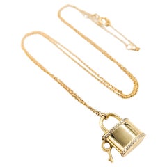 Lock & Key Elegance: 14k Yellow Gold Diamond Pendant