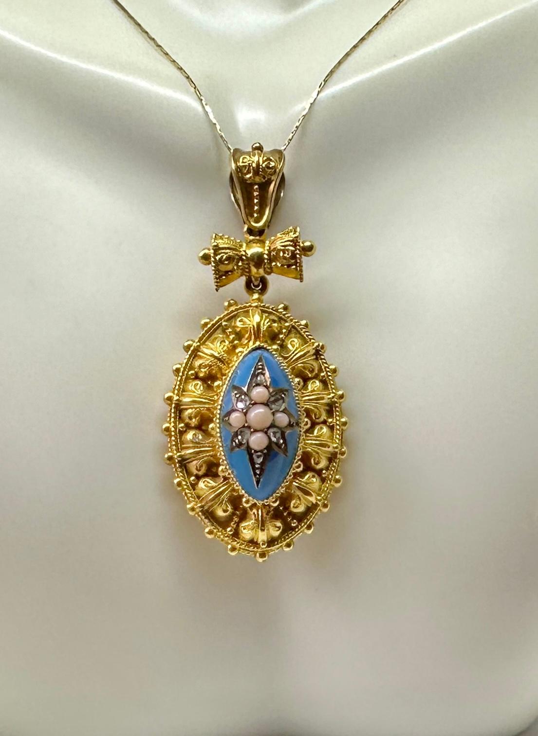 Indulge in a museum quality antique Etruscan Revival locket pendant necklace in a magnificent Belle Epoque design with a Robin's Egg Blue Enamel domed center with Angel Skin Coral and Rose Cut Diamond adornments in a Star Motif Design.  The locket