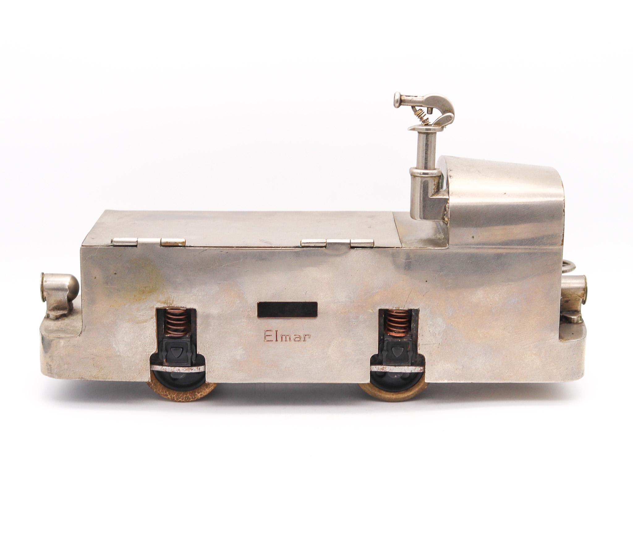 Sugar cane locomotive cigarette case box with lighter.

Very decorative presentation cigarette box, created in the shape of a locomotive or sugar cane tram, back in the 1910. Crafted with excellent skills in solid steel with rubber tires showing