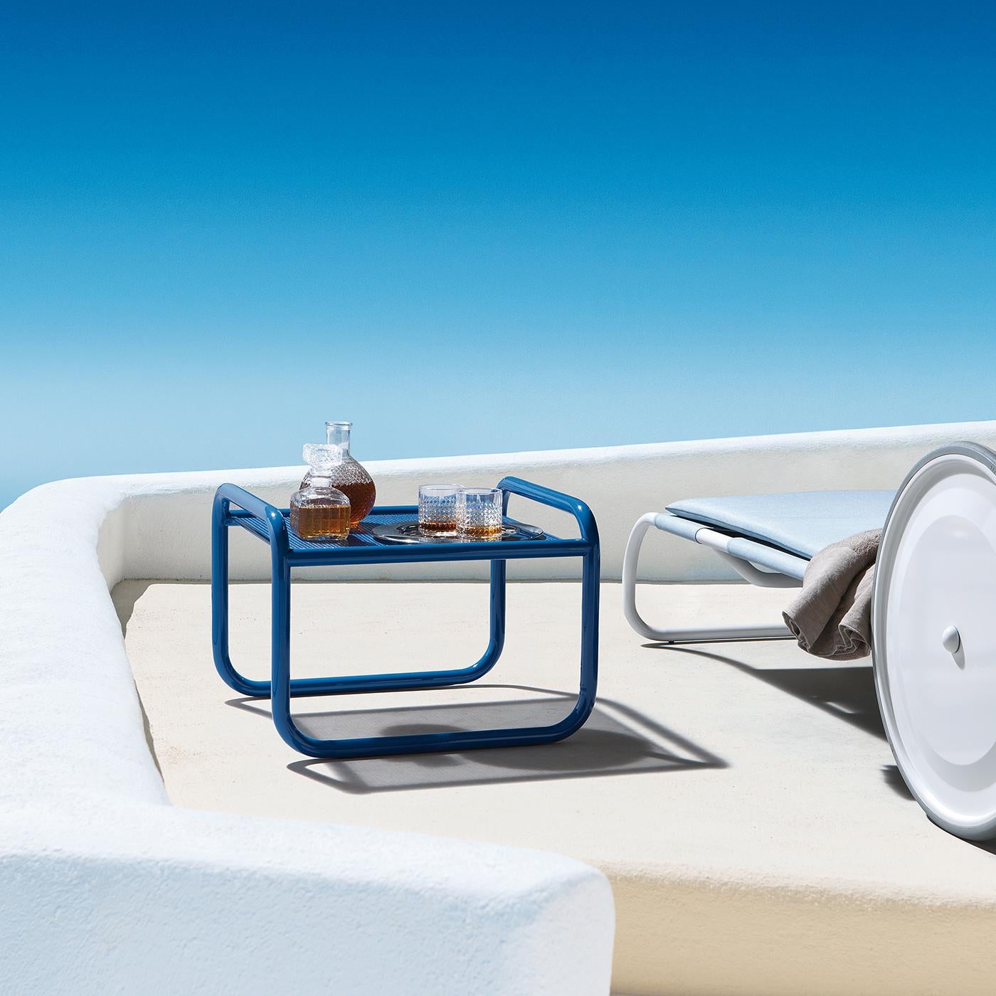 Aimed at bringing the same attention to detail usually reserved for interior decor, Gae Aulenti’s Locus Solus collection will transform a patio, garden, or veranda into a totally original and colorful place of sparkling personality. The cobalt blue