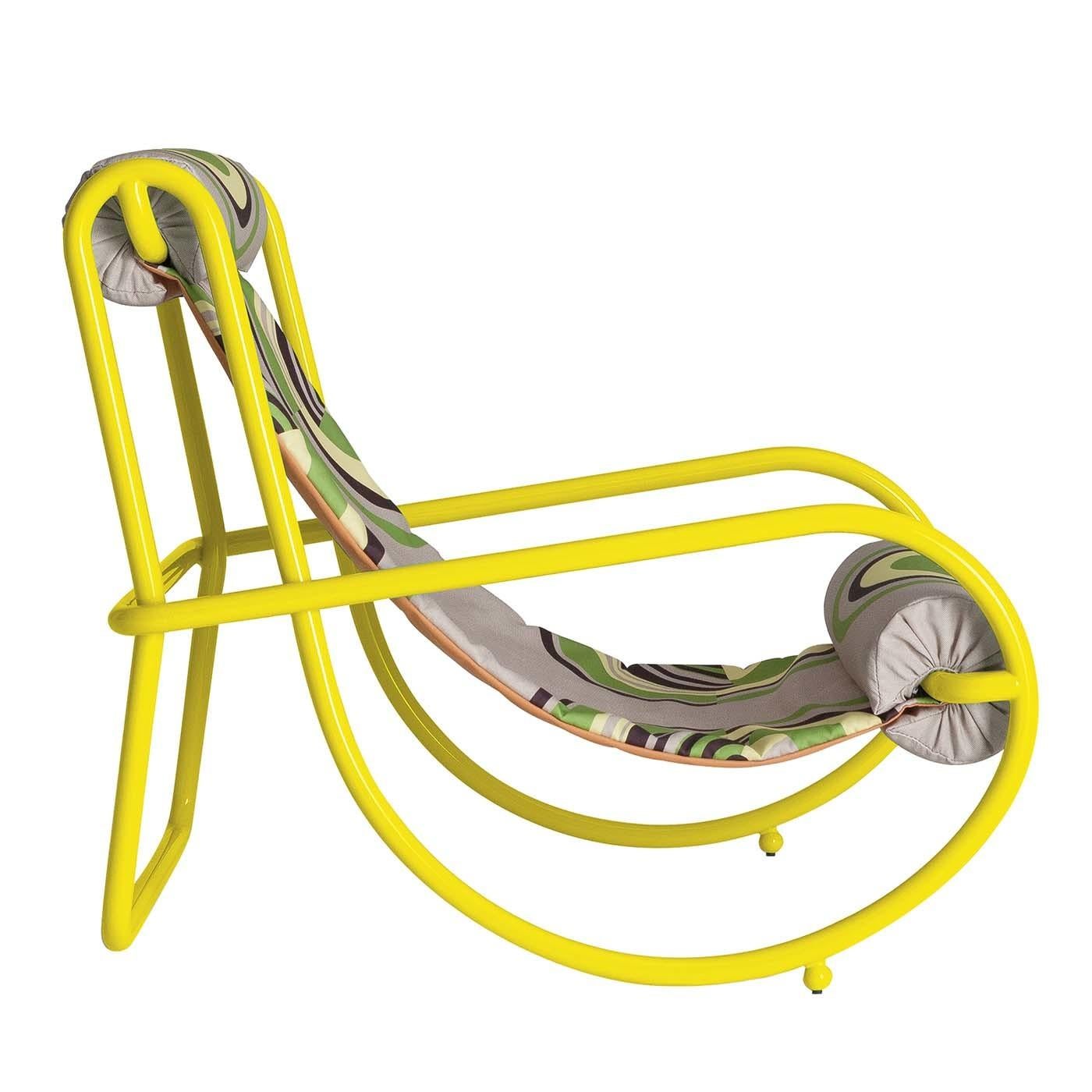 Perfect for the deck, pool, patio, and garden, this unique armchair features exaggerated volumes and a sinuous silhouette made of tubular steel finished in a bright yellow color. Designed by Italian architect Gae Aulenti in 1964 as part of the