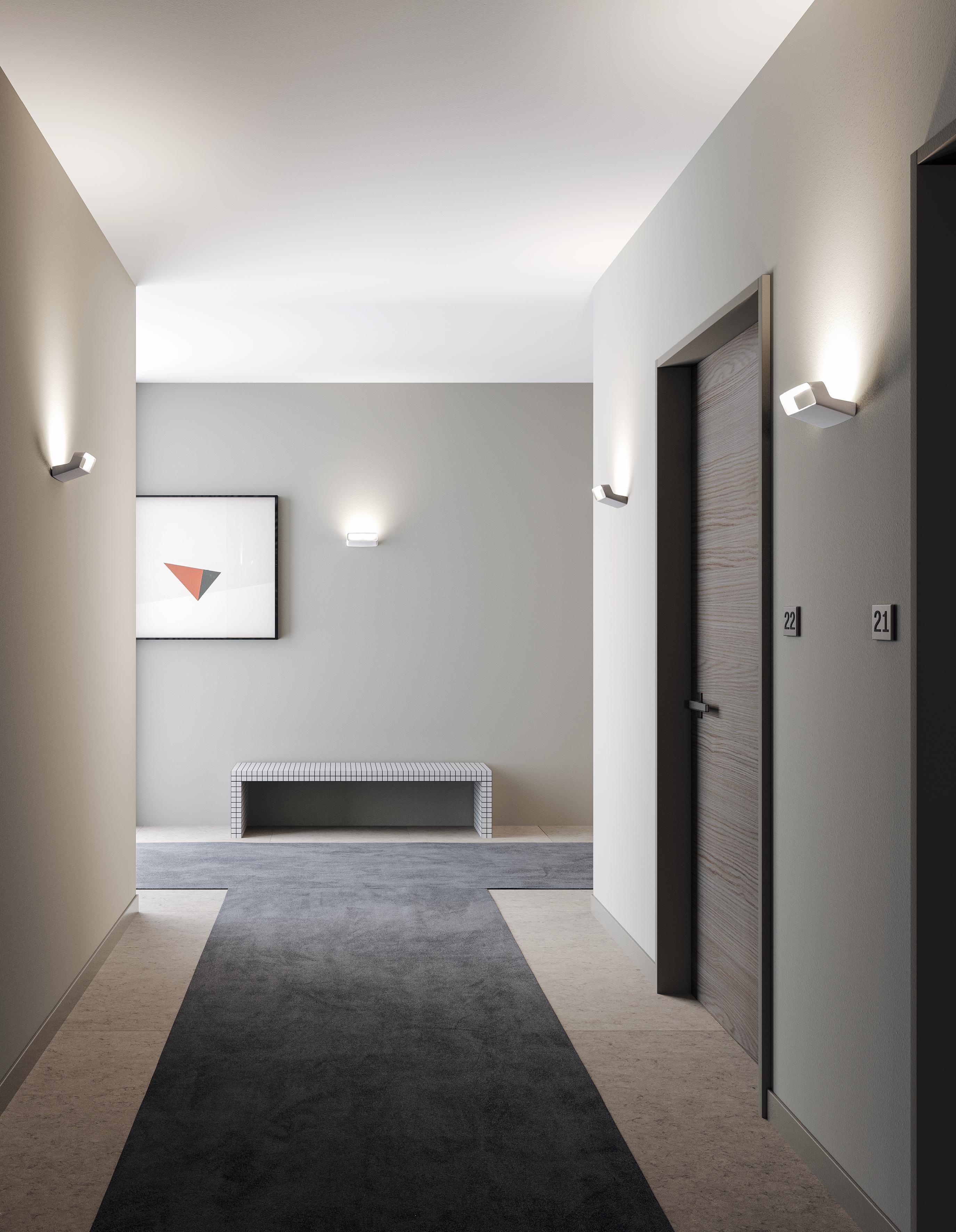 Die Aluminium-Wandleuchte Aile zeichnet sich durch ein schlichtes und dynamisches Design aus, das an die Querruder von Sportwagen erinnert, nach denen sie auch benannt wurde. Die kompakte Größe, das schlanke Design, die starke Lichtleistung im