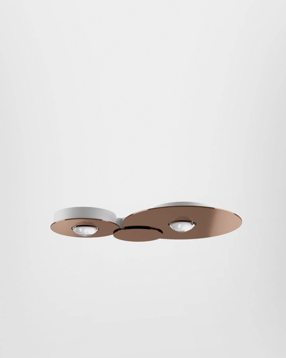 Round, compact forms featuring elegant finishes with a centre that shines like a precious stone. Once lit up, Bugia amazes with the unexpected effect of its light. A surprising and harmonious balance between direct and indirect light, diffused both