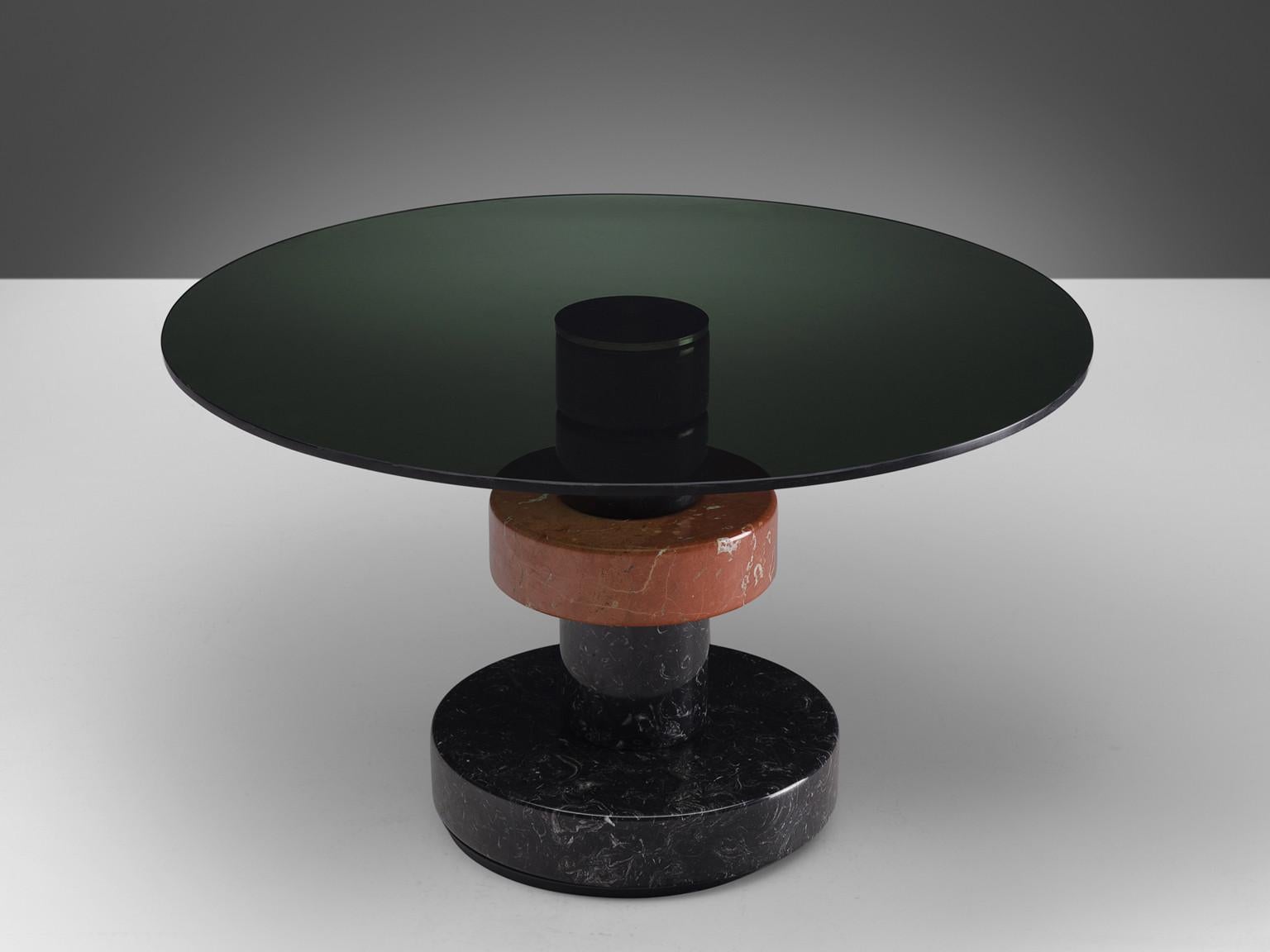 Lodovico Acerbis and Giotto Stoppino for Acerbis International, dining table model 'Menhir', marble, stainless steel, glass, Italy, 1983.

This sculptural dining table with a round top was part of the 