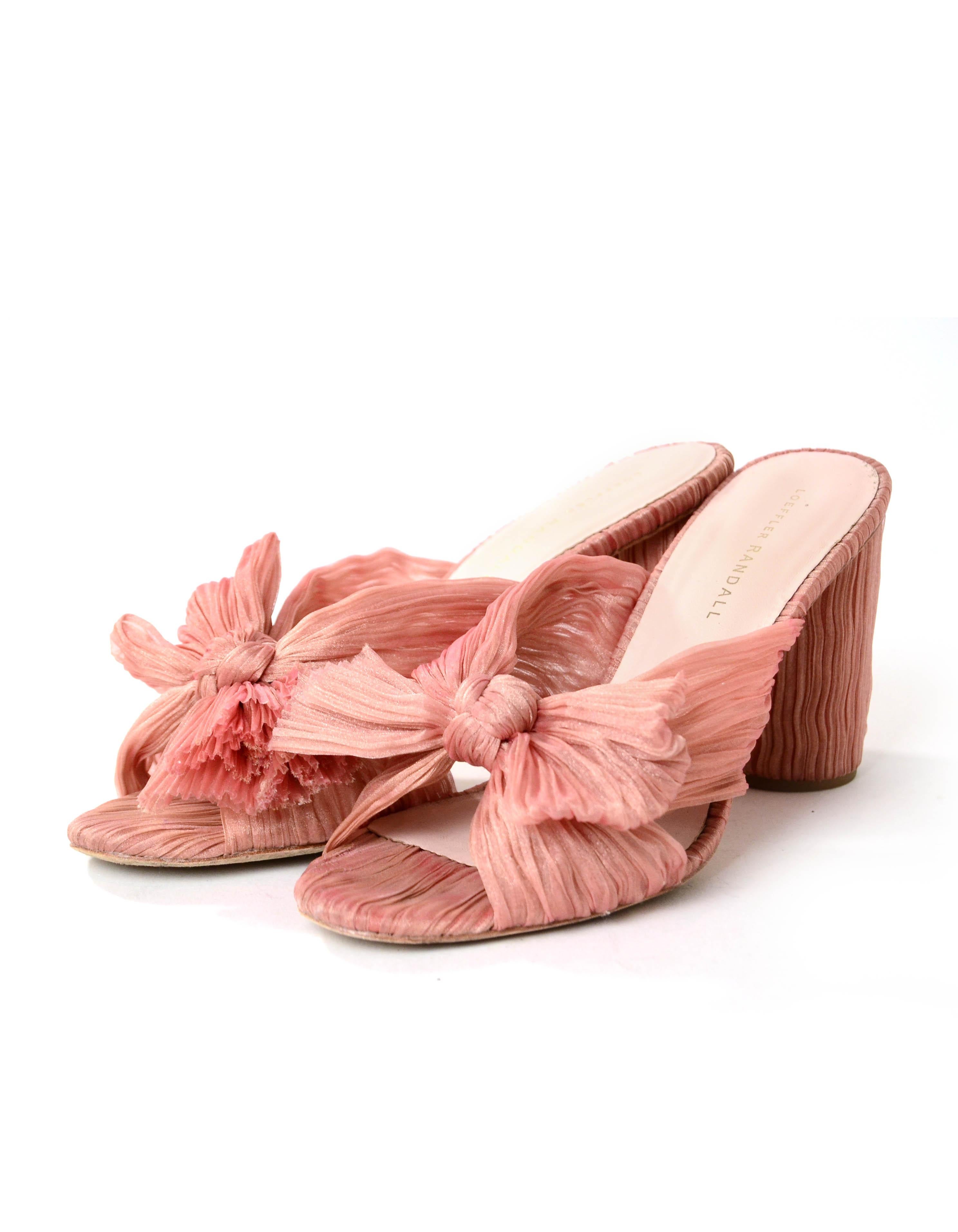 Loeffler Randall Penny Knotted Metallic Mules

Made In: China
Color: blush/rose gold
Materials: Metallic
Closure/Opening: Slip on
Overall Condition: Excellent - wear to soles

Estimated Retail: $395.00
Marked Size: 9.5
Heel Height: 3.5”