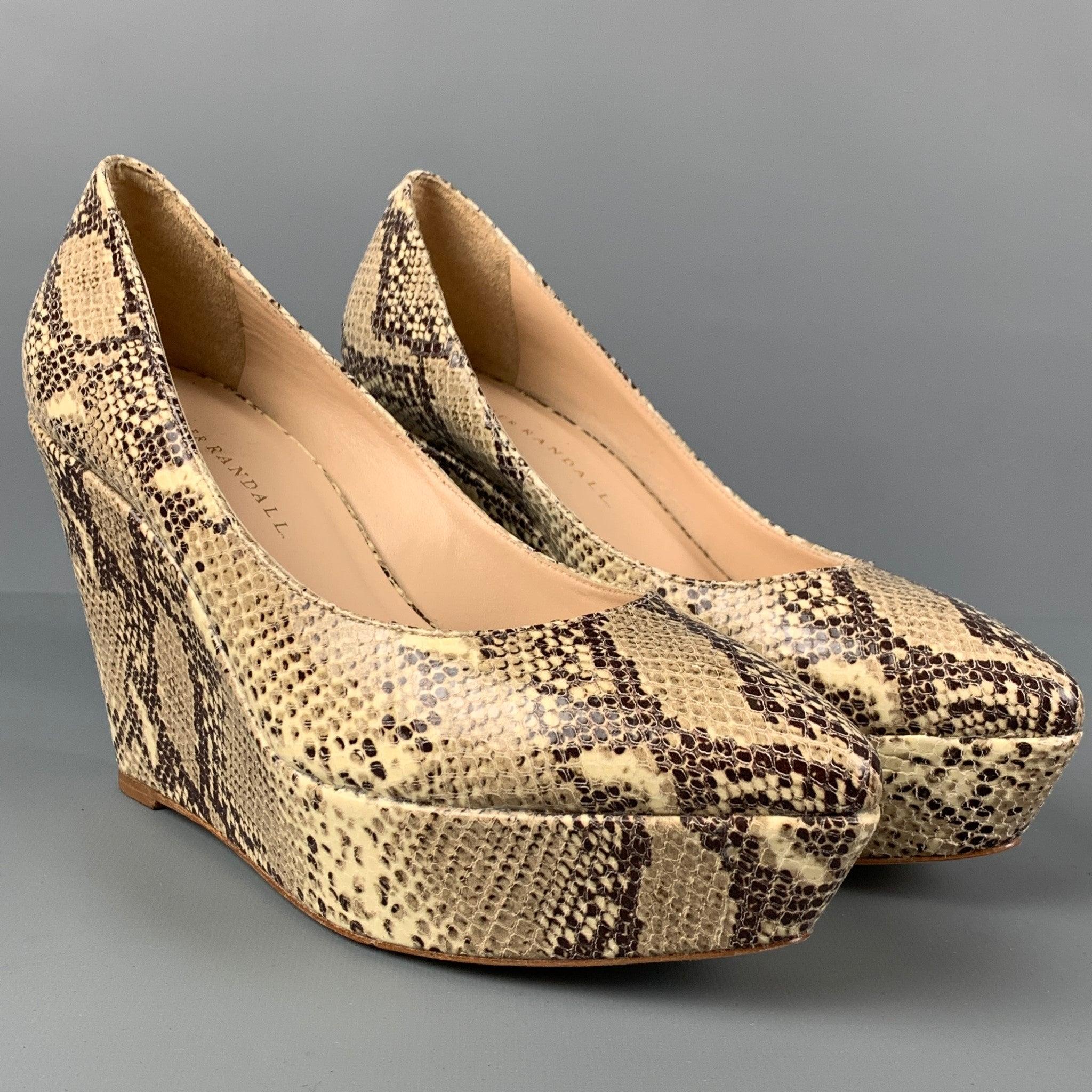 LOEFFLER RANDALL pumps comes in a grey & beige leather snake skin print featuring a pointed toe and a wedge heel.
Very Good
Pre-Owned Condition. 

Marked:   8 

Measurements: 
  Heel: 4 inches  Platform: 1 inches 
  
  
 
Reference: 115611
Category: