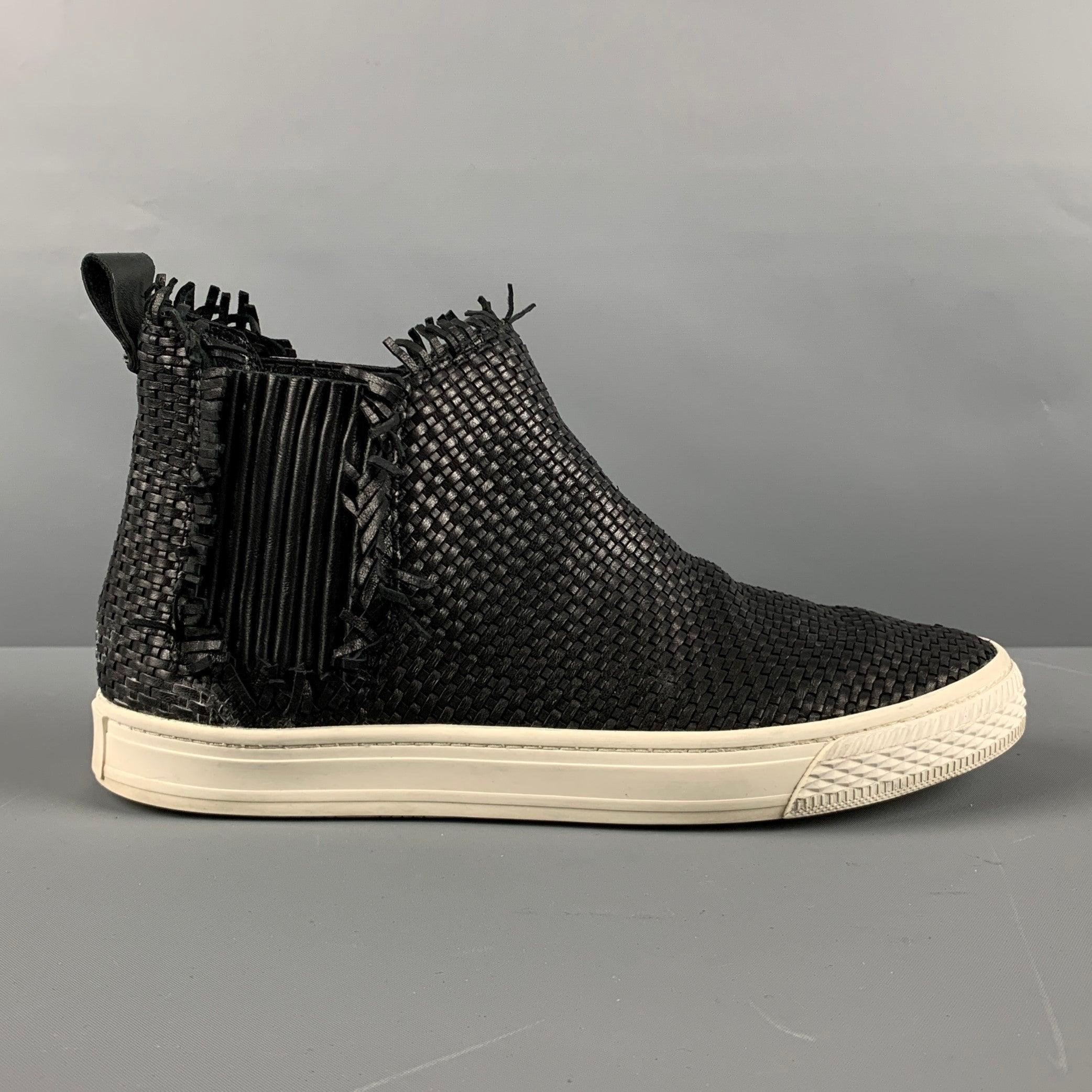 LOEFFLER RANDALL high top sneakers come in black leather with a basket weave texture, slip on design, and white rubber sole. Very Good Pre-Owned Condition. 

Marked:   8.5Outsole: 9.75 x 3 inches 
  
  
 
Sui Generis Reference: 129554
Category: