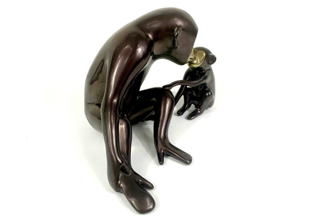 Classic Mid Century design with patinated and polished finish. Depicts a mother and child chimpanzee monkey in a loving gesture. Artist signature and limited edition number 513/750 on base as shown.

Dimensions: 8 1/2