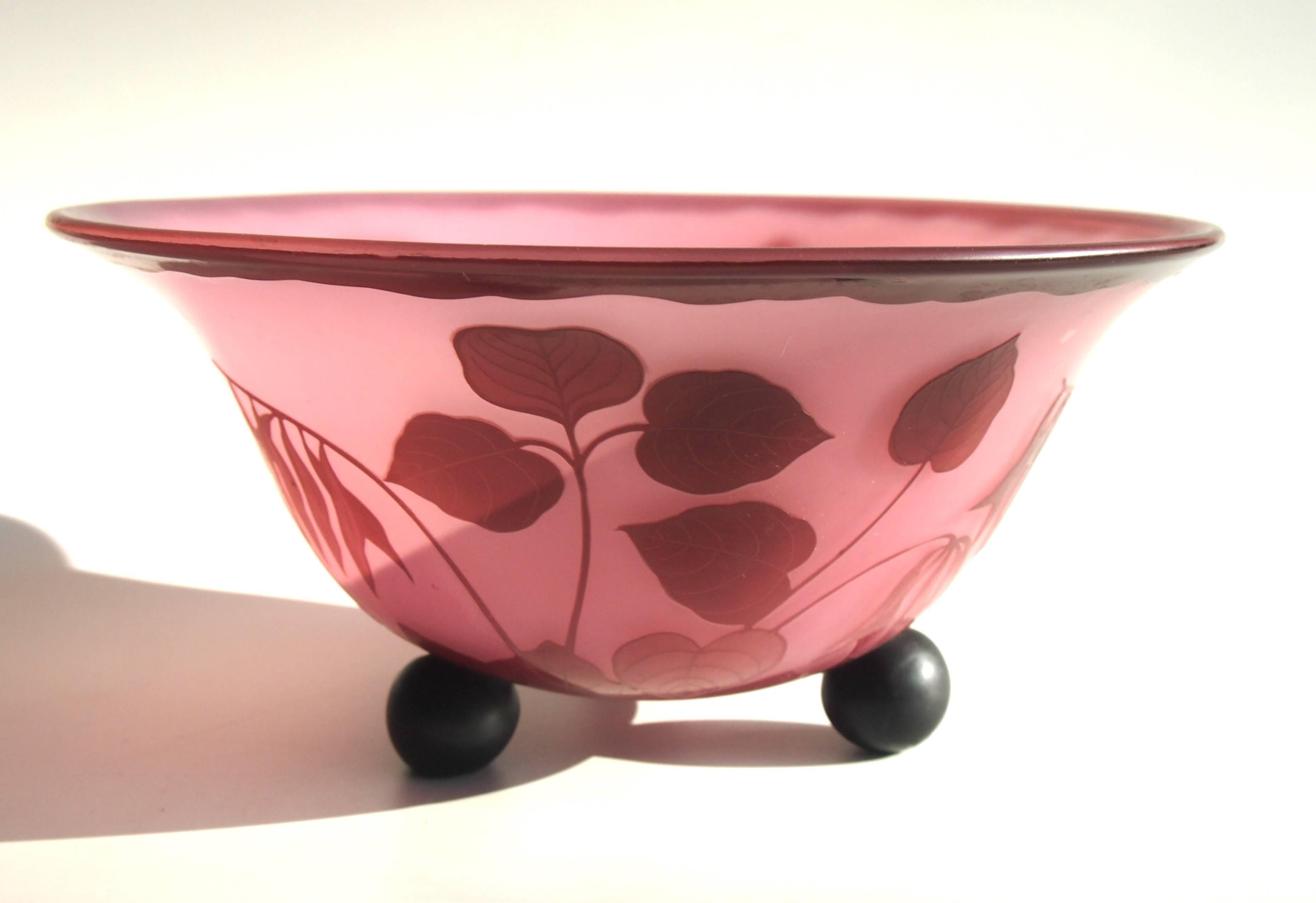 Rare three footed Loetz Art Deco Cameo bowl in purple/pink over pale pink depicting trailing leaves. This is a high quality cameo unlike the pieces signed 'Richard'. 

Loetz was and still is probably the most famous and most collected of the great