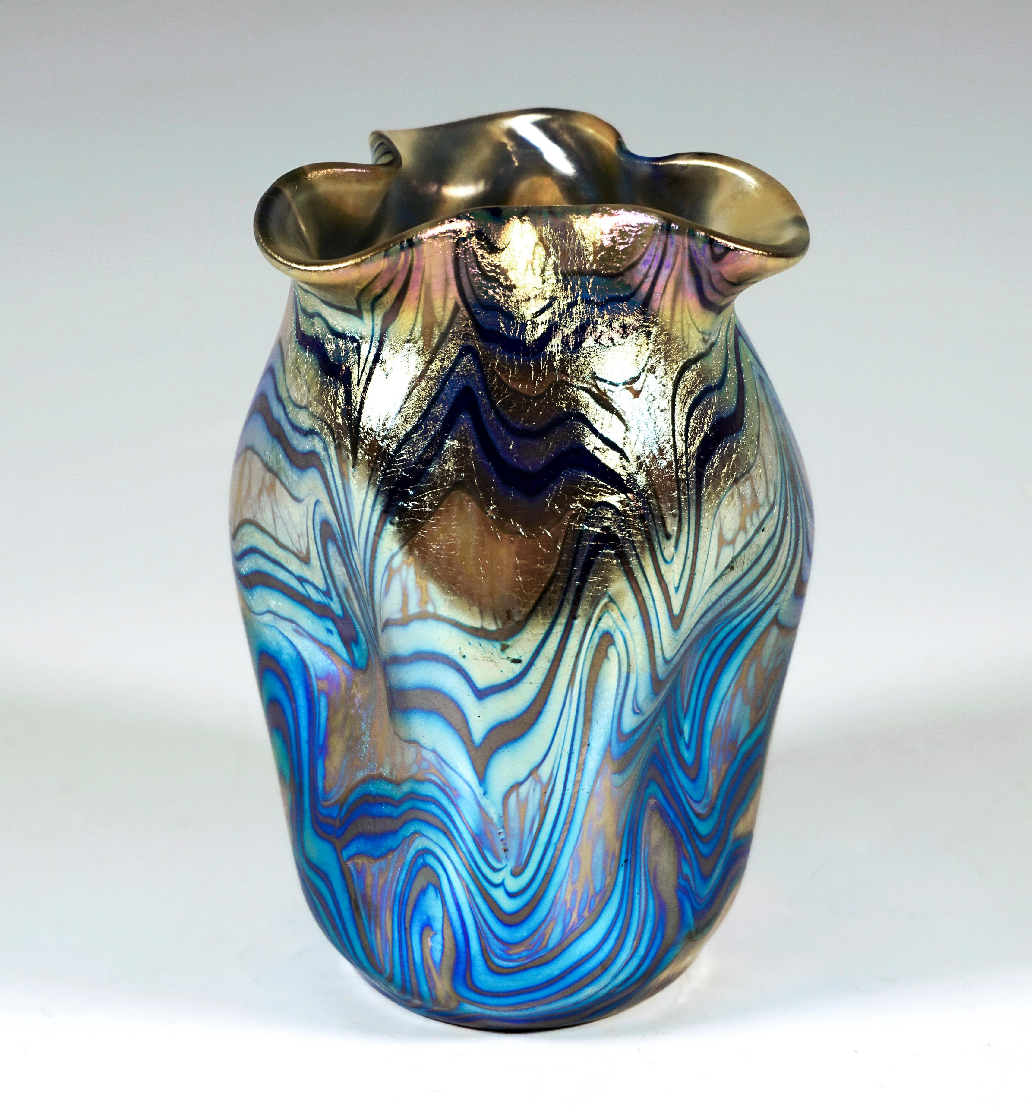 
Finest Bohemian Art Nouveau Glass Vase:
Blown into shape of raised body on a round ground plan, triple depressed wall with mouth rim formed into trefoil, polished pontil, with ground 
signature 'Loetz Austria'.

Shape: Series II, Prod. No. - PN