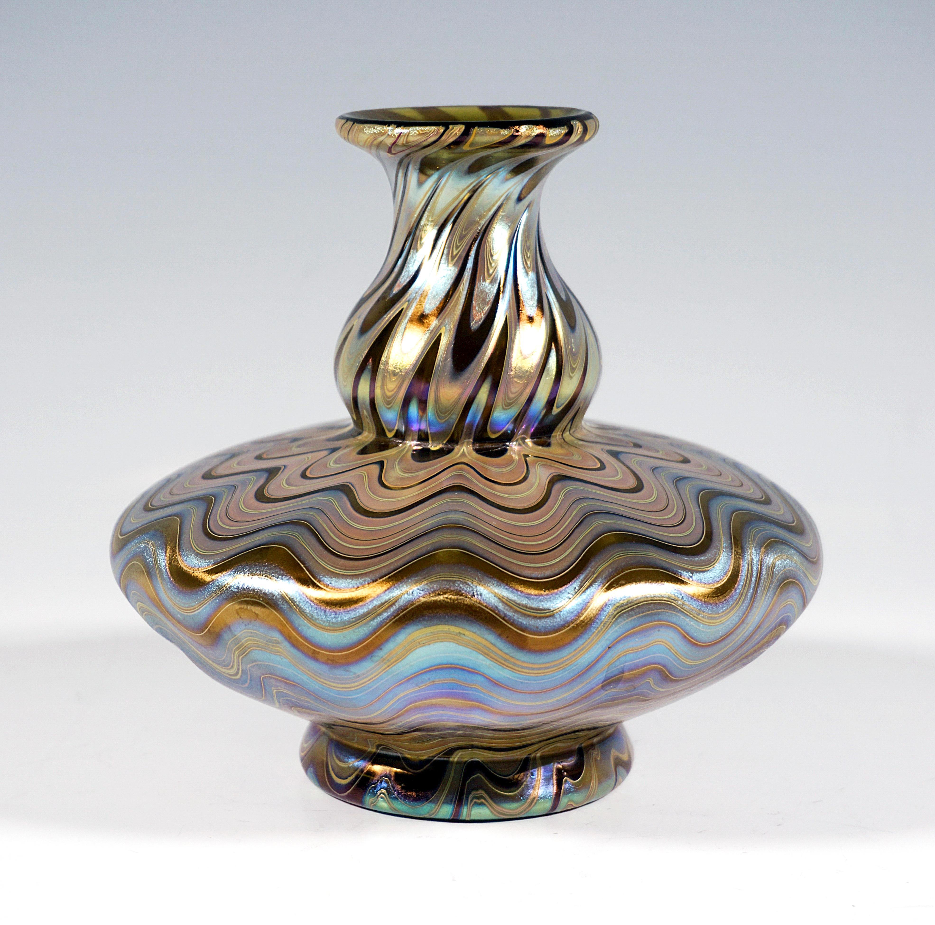 Finest Bohemian Art Nouveau Glass Vase:
Blown into form baluster-shaped body with discus-shaped protruding belly part, attached spherical curved neck with flared mouth rim, stepped flush stand with cut out polished pontil, ground signature 'Loetz