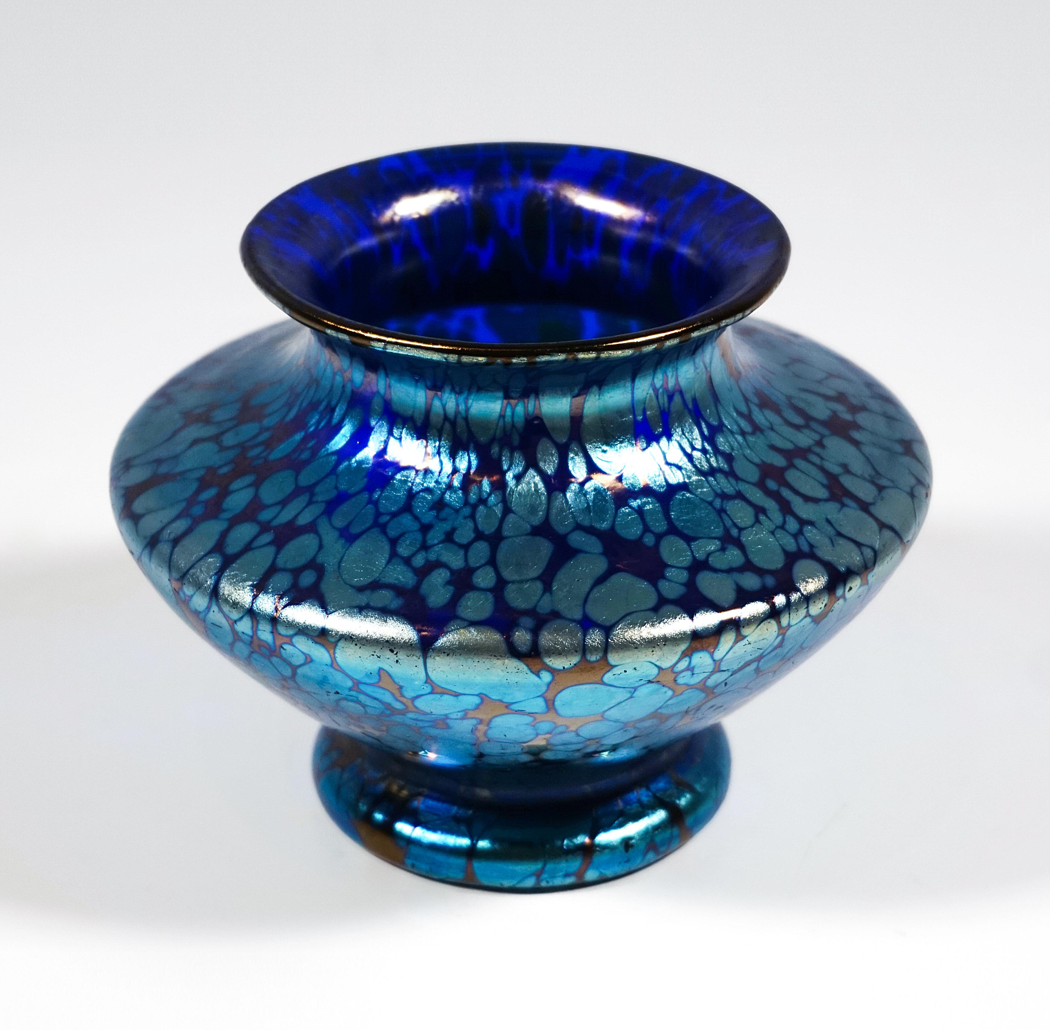 Finest Bohemian Art Nouveau Glass Vase:
Mould blown glass on a round foot, widening after constriction and then abruptly narrowing into a disc-like shape to form a wide neck, with a raised, flared rim, and a polished pontil on the underside.

Form: