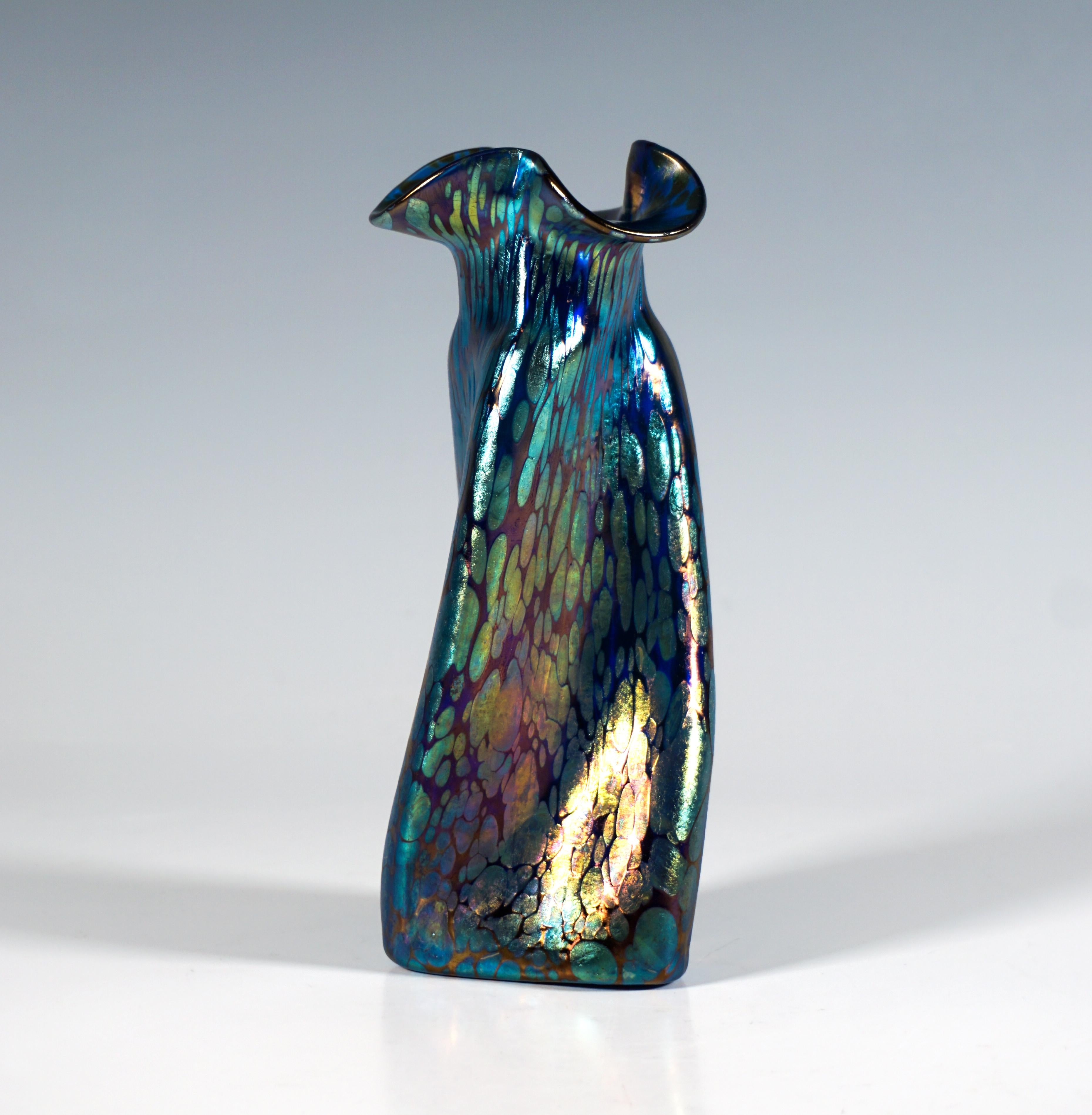 Finest Bohemian Art Nouveau Glass Vase:
Mould blown glass on flush stand, three-part ground plan, the three-sided body rising up and narrowing slightly towards the top, twisted once to the right, above a short neck constriction, a three-lobed mouth