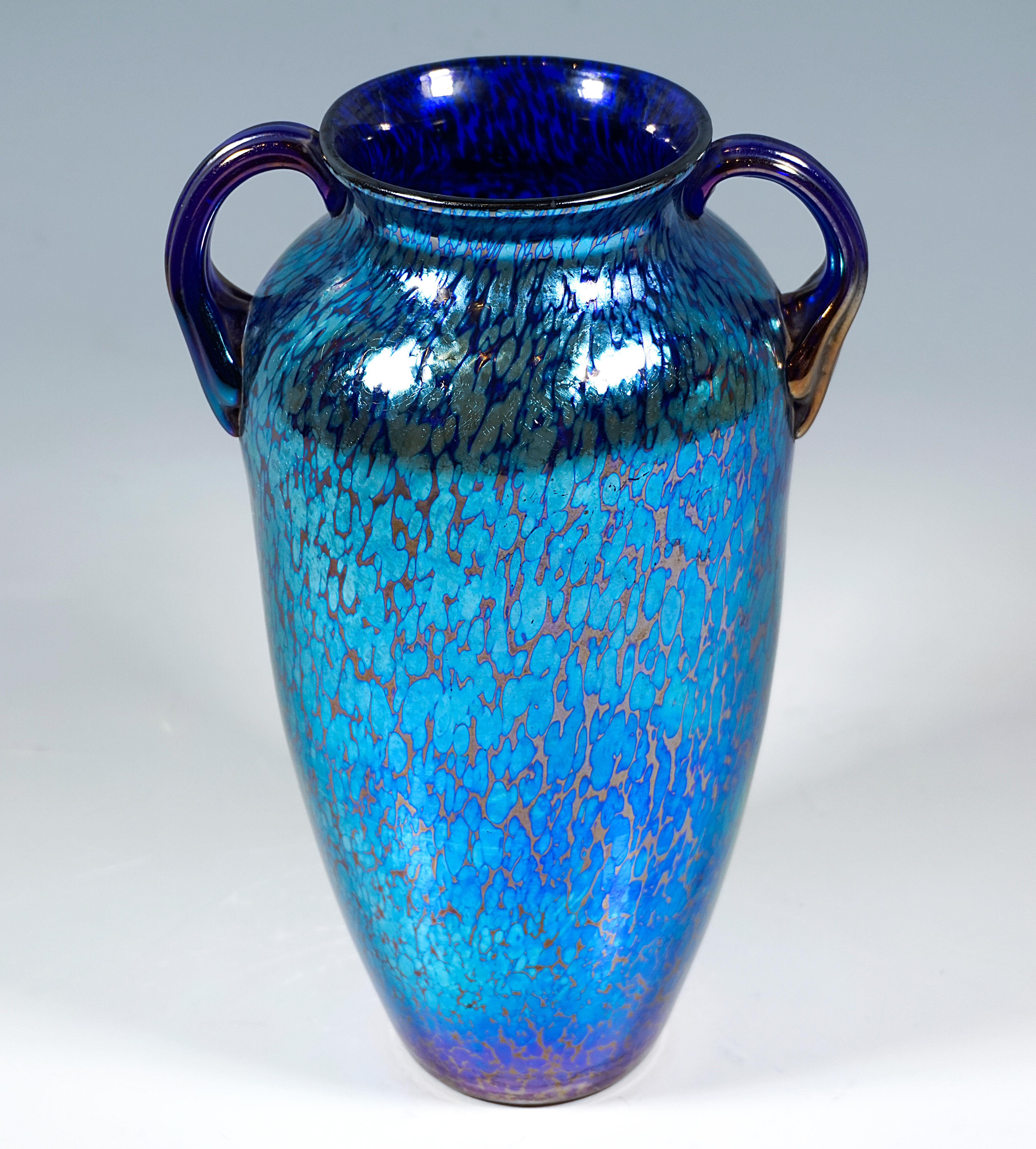 Finest Bohemian Art Nouveau glass vase:
Mould-blown vase in the style of an amphora on a flush stand with raised, slightly bulging walls, constricted neck and slightly flared mouth rim, two applied, six-piece ribbed handles, polished
