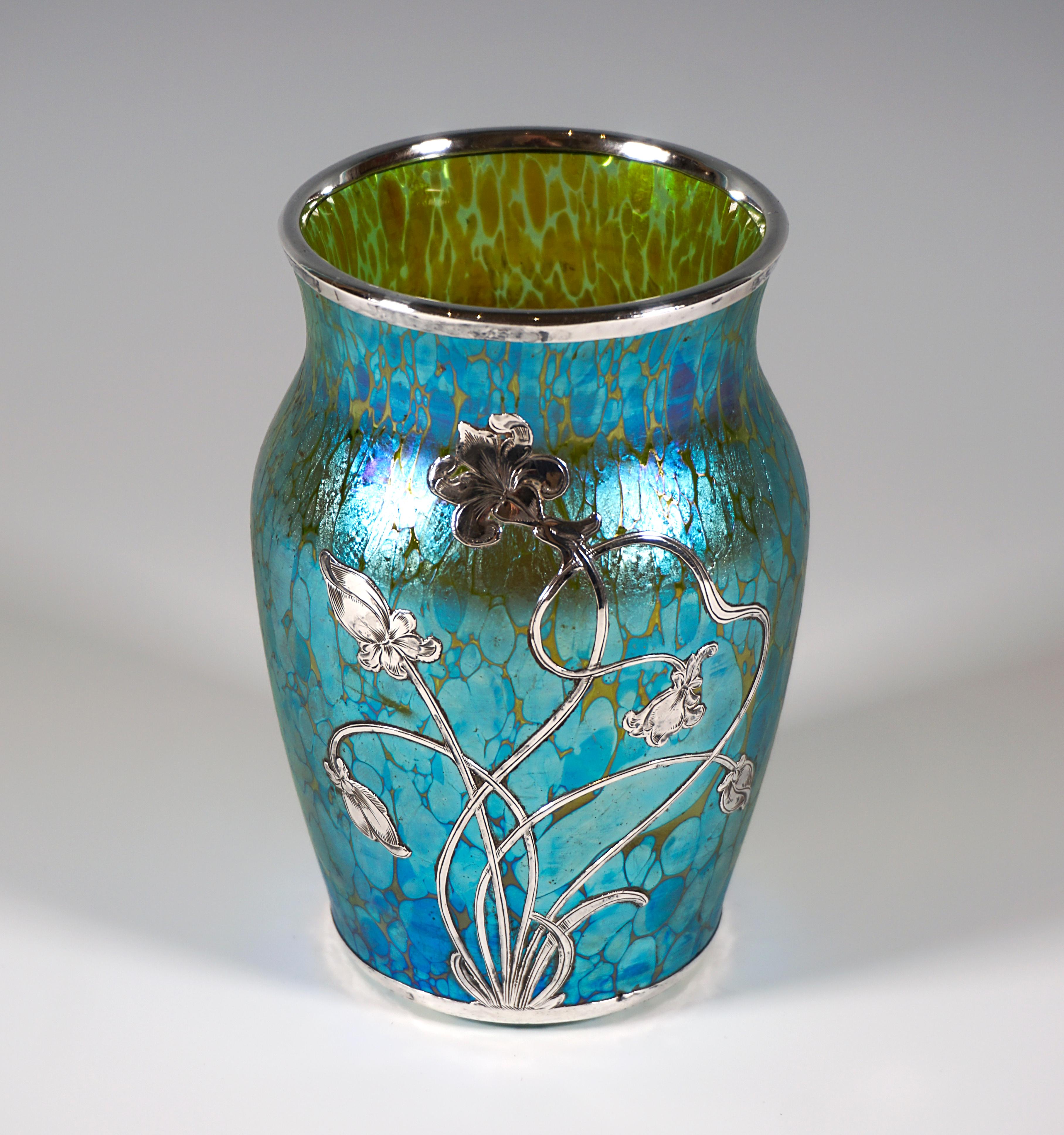 Finest Bohemian Art Nouveau glass vase.
Mould blown, baluster-shaped body with a flush stand, slightly widening towards the top, gentle constriction and slightly flared mouth rim, indicated pontil on the underside.
Finely designed silver plating