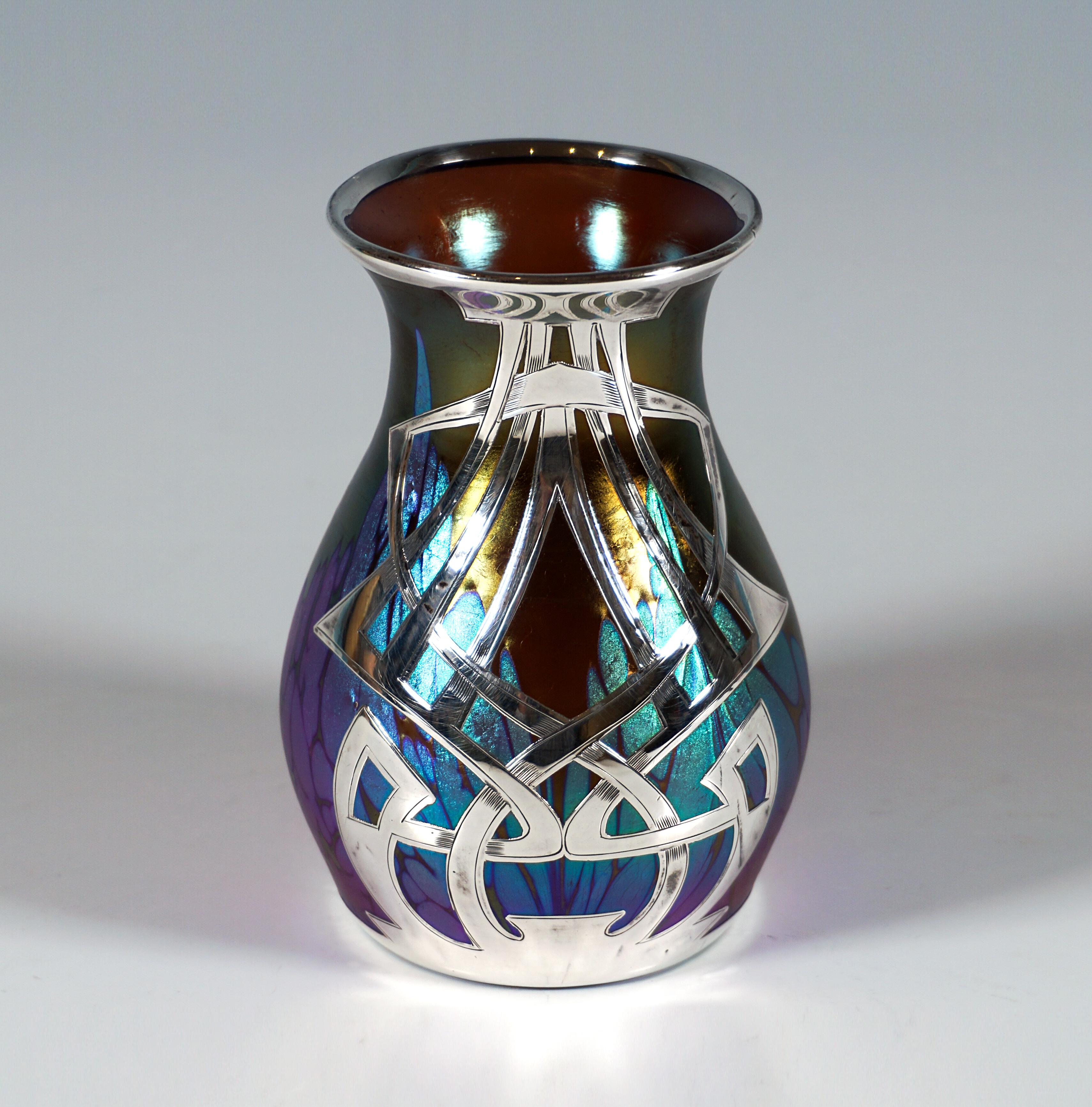 Finest Bohemian Art Nouveau Glass Vase.
Mould blown glass on flush stand, raised bulbous body in form of a baluster, flared lip rim over a slight neck constriction, ground and polished pontil on the underside.
Rims on the bottom and top edged with