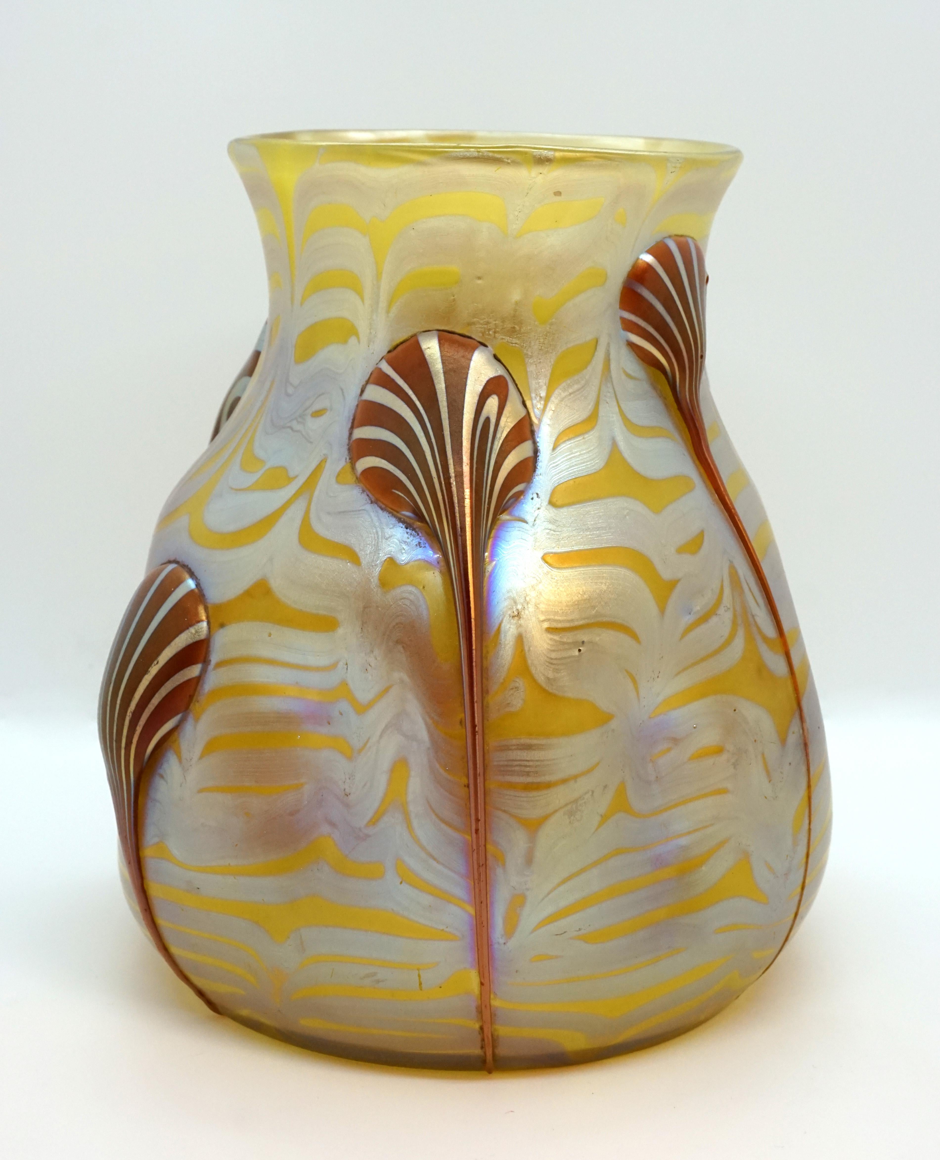 Finest Bohemian Art Nouveau glass vase

Blown, bulbous body with a raised mouth rim. Body pressed six times. Based on a round floor plan.

Shape: Series II Prod. Nr. 844, circa 1900

Decor: colorless glass covered with yellowish opal on the