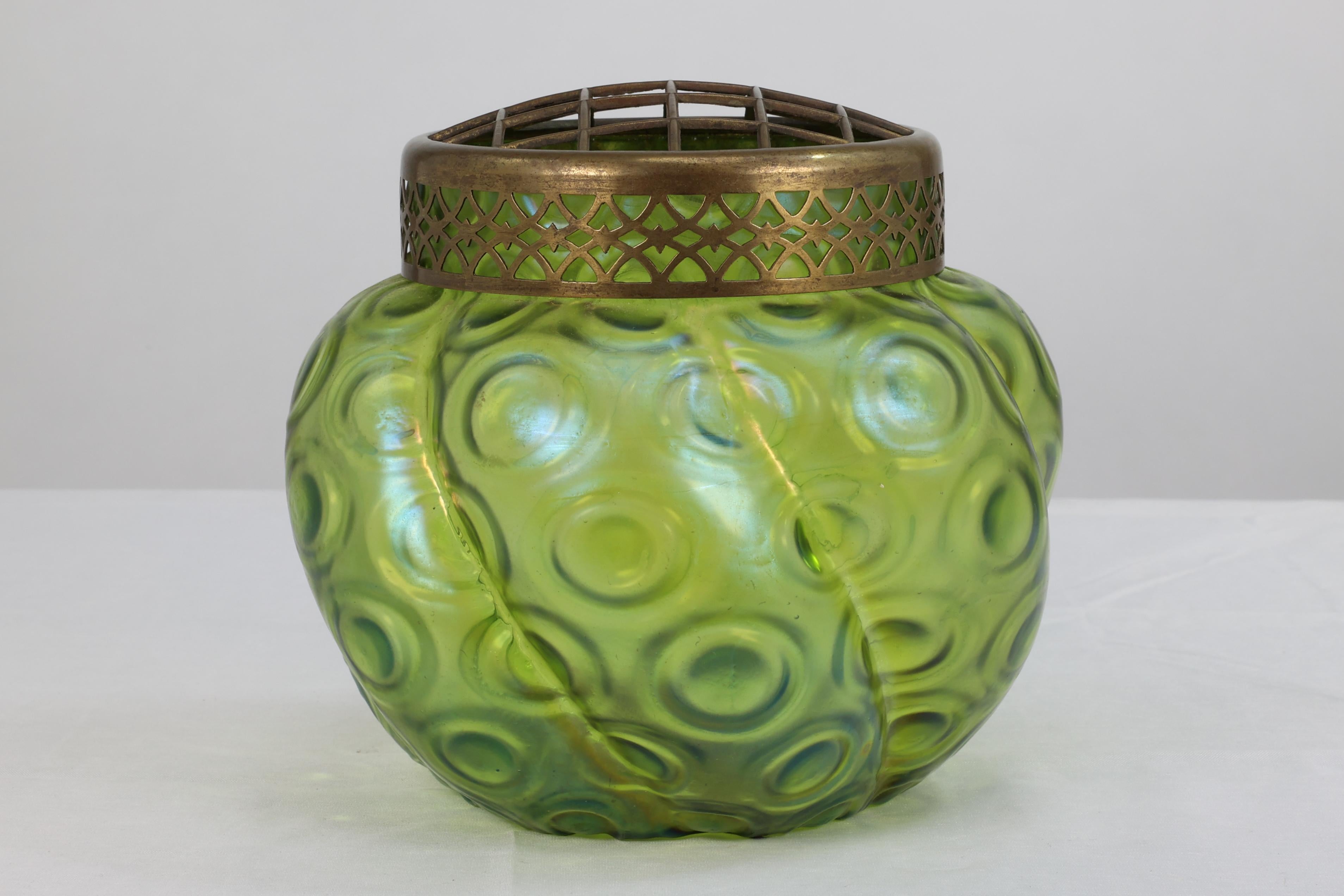 Art Nouveau Loetz (attributed). A green swirl glass flower holder with decorative brass top For Sale