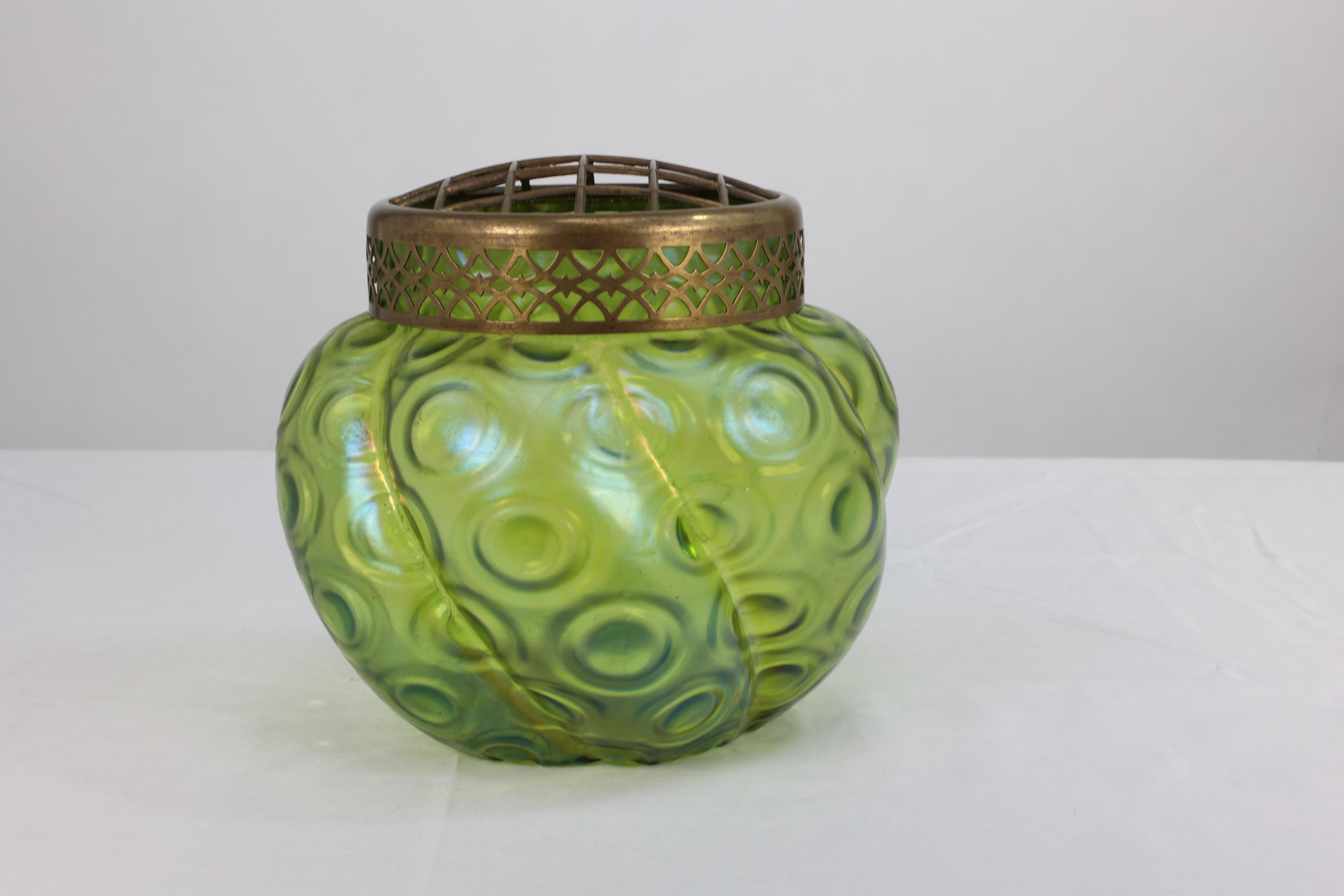 European Loetz (attributed). A green swirl glass flower holder with decorative brass top For Sale
